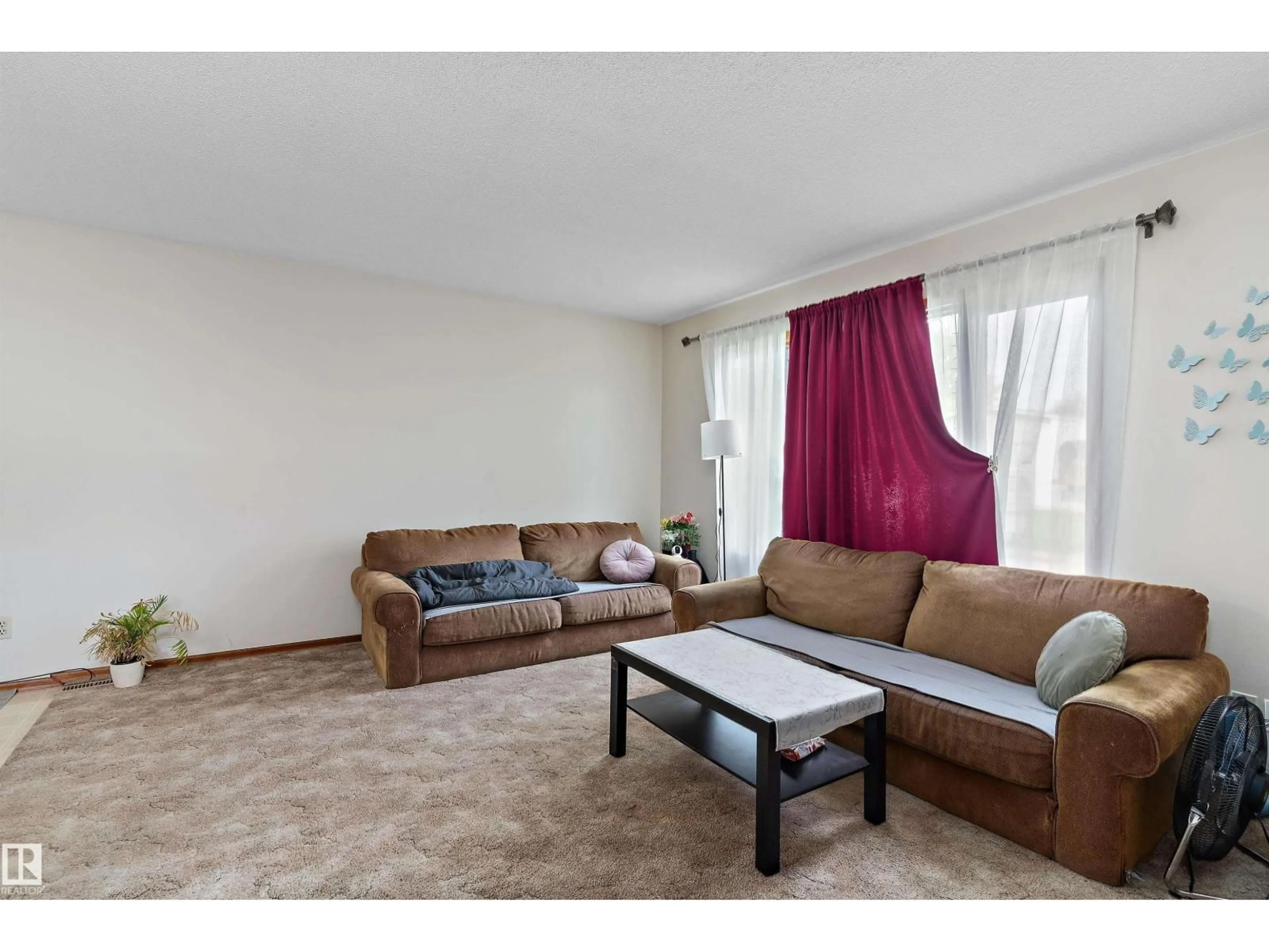 Living room with furniture, unknown for 3825/27 53A ST, Wetaskiwin Alberta T9A2P5