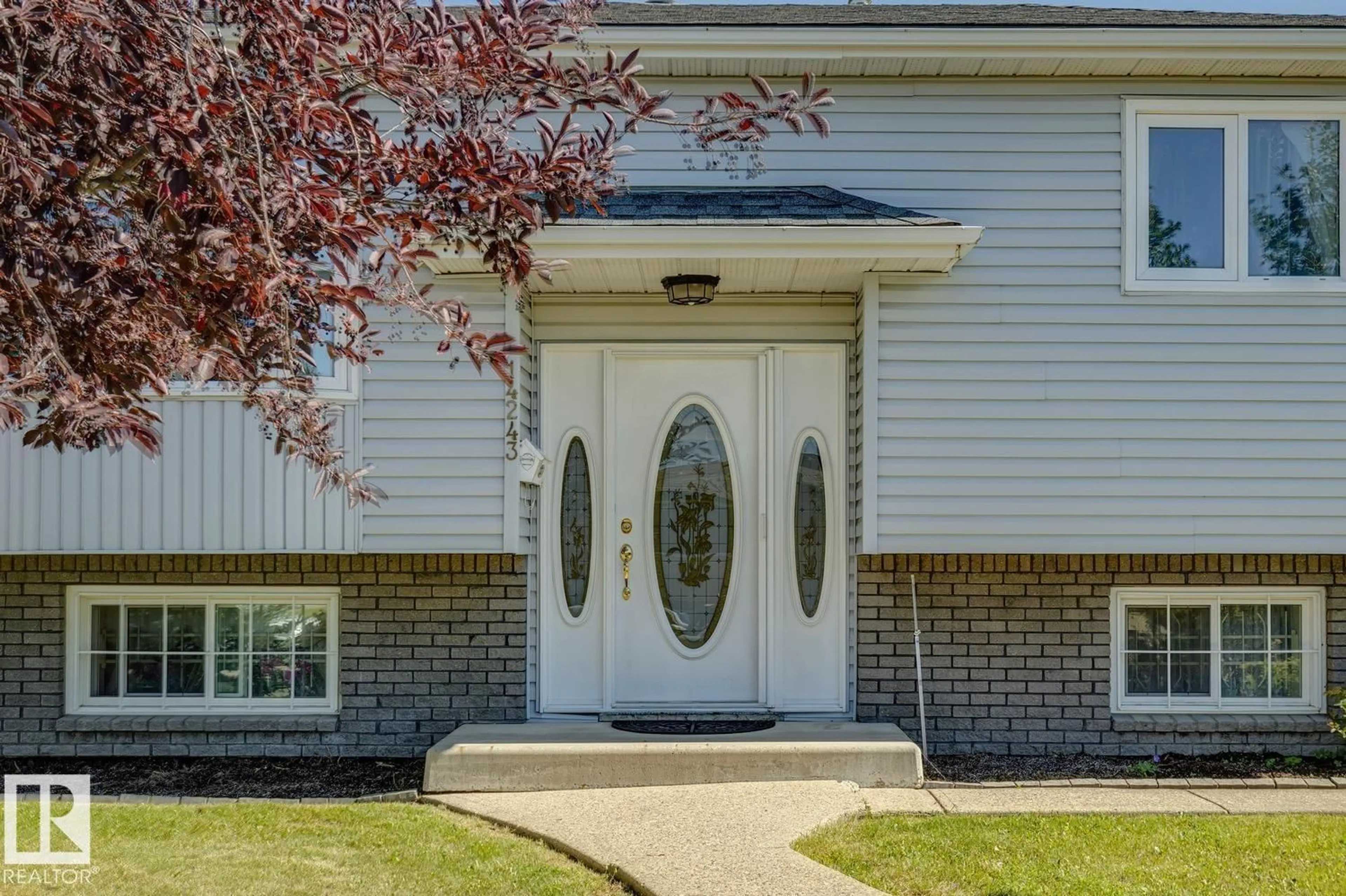Home with vinyl exterior material, street for 14243 24 ST, Edmonton Alberta T5Y1G2