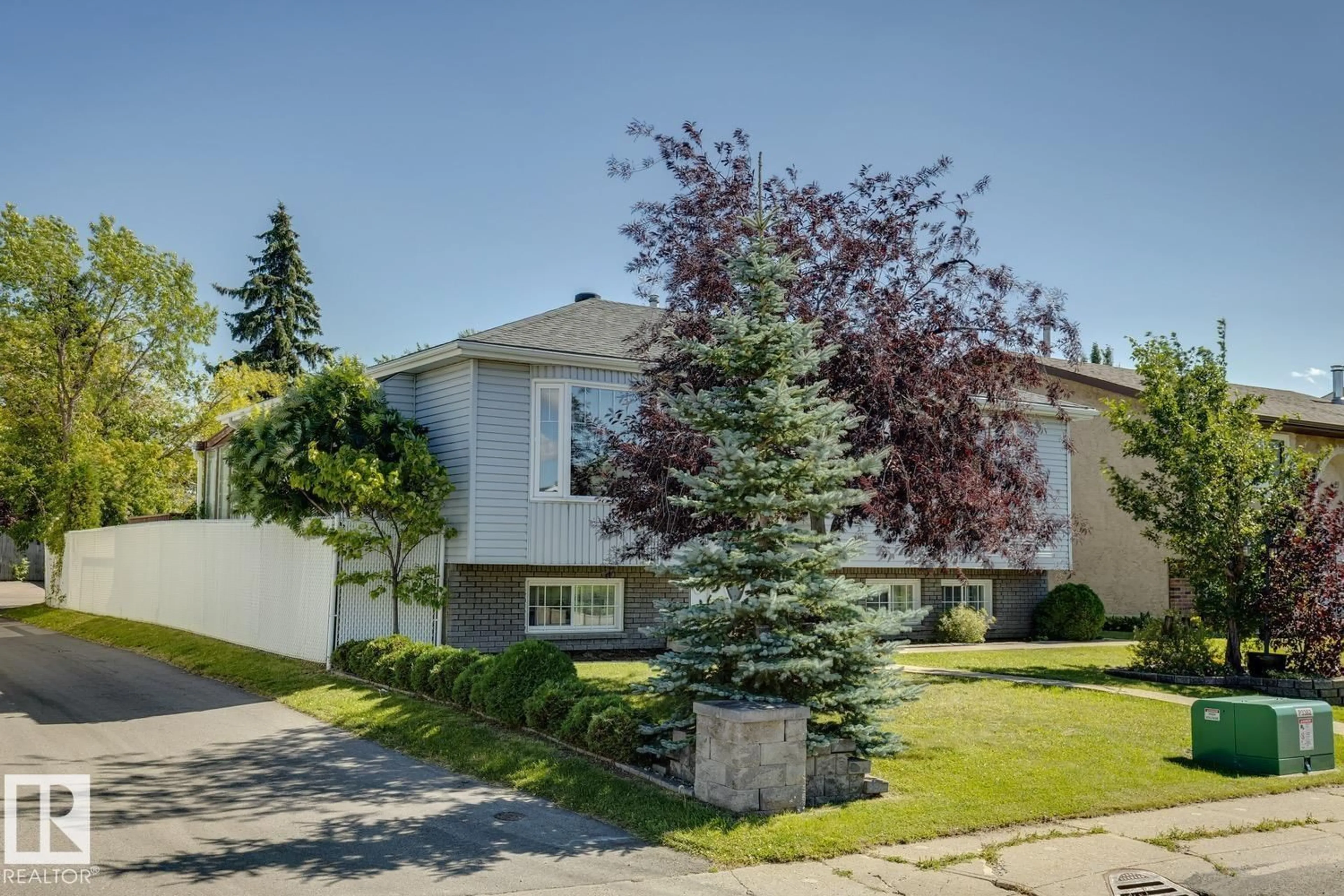 Home with vinyl exterior material, street for 14243 24 ST, Edmonton Alberta T5Y1G2