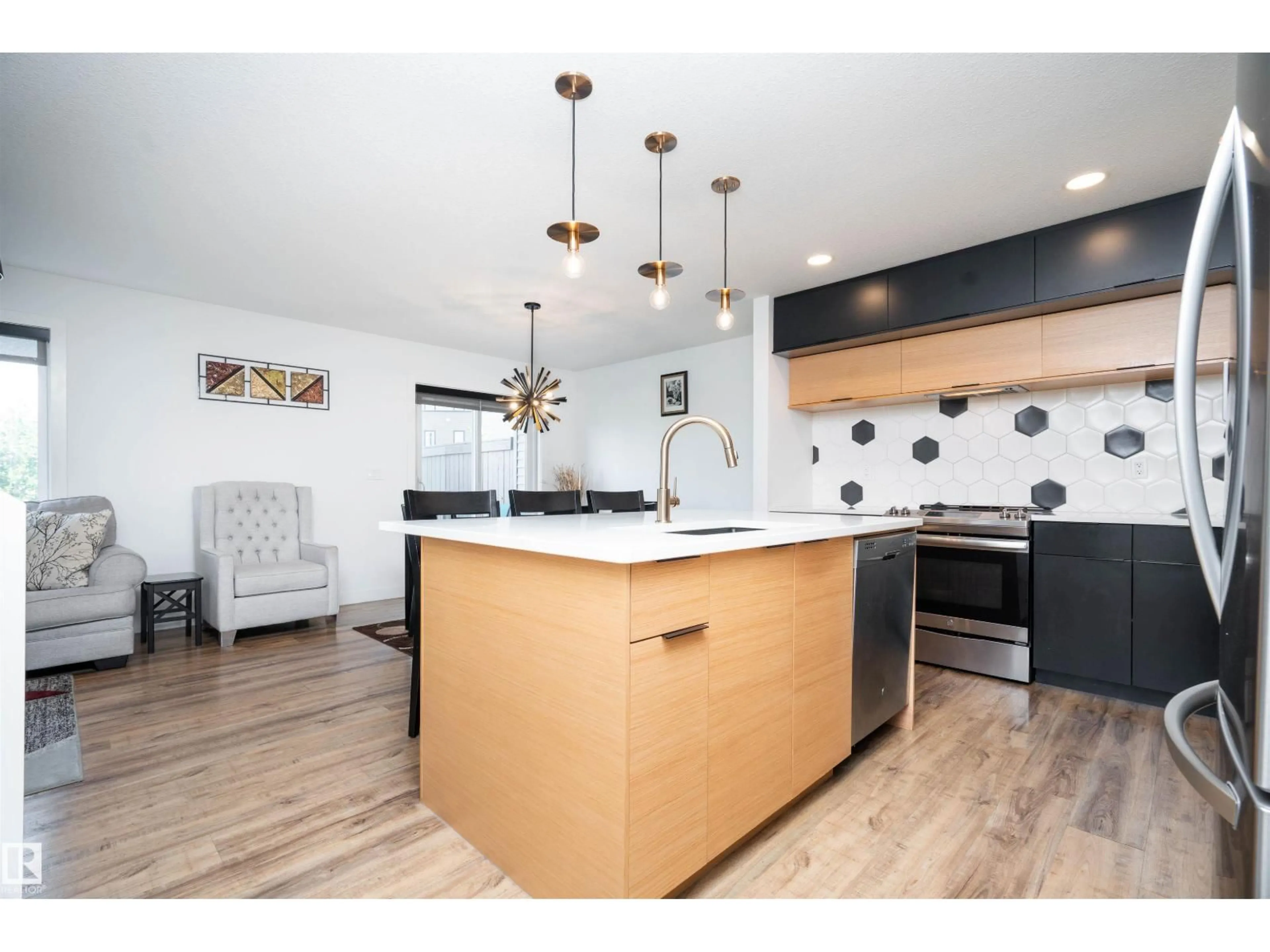 Open concept kitchen, wood/laminate floor for SW - 9104 PEAR DR, Edmonton Alberta T6X2N7