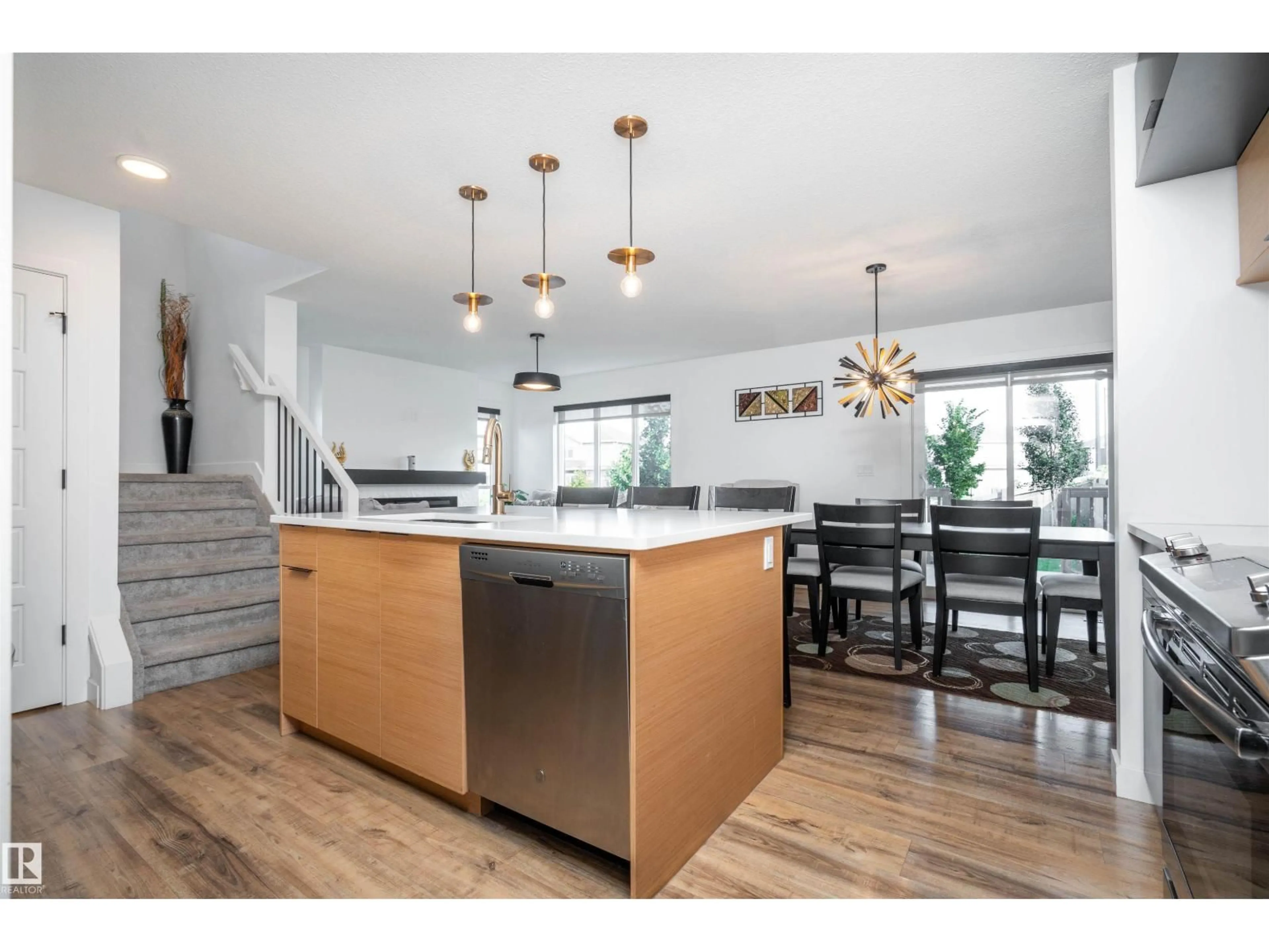 Open concept kitchen, wood/laminate floor for SW - 9104 PEAR DR, Edmonton Alberta T6X2N7