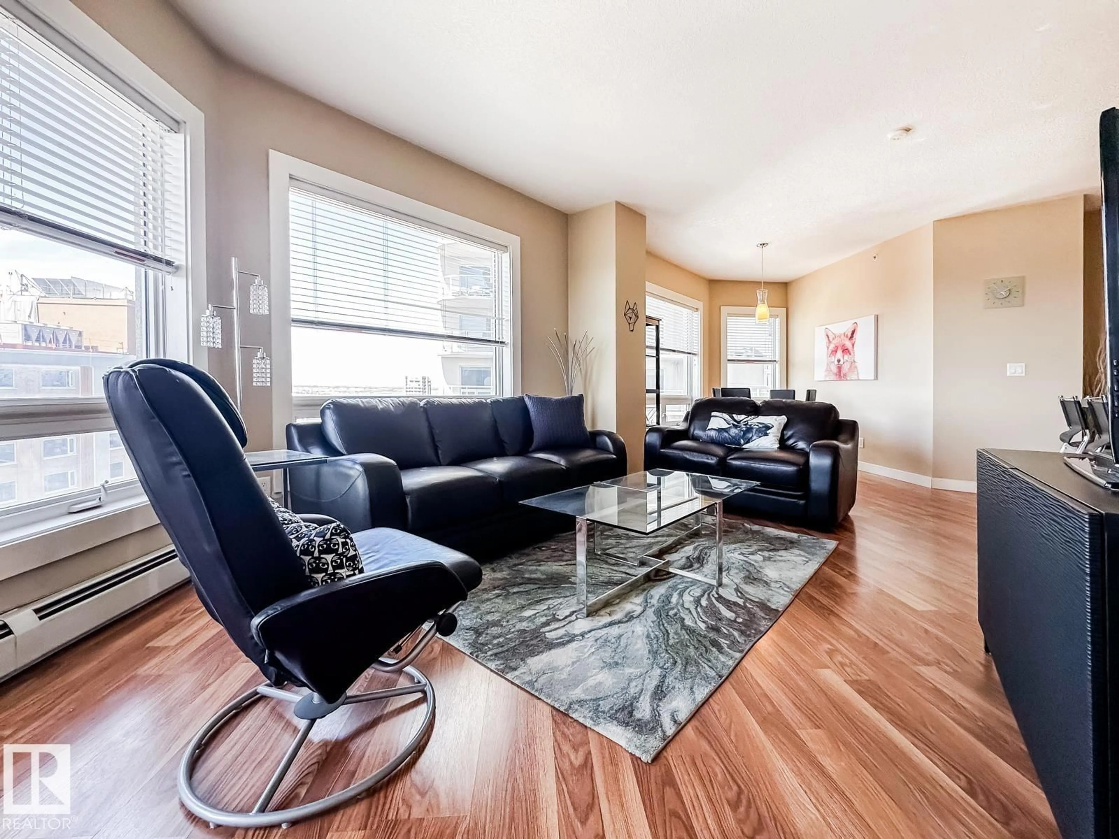 Living room with furniture, wood/laminate floor for 10136 - 1901 104 ST NW, Edmonton Alberta T5J0B5