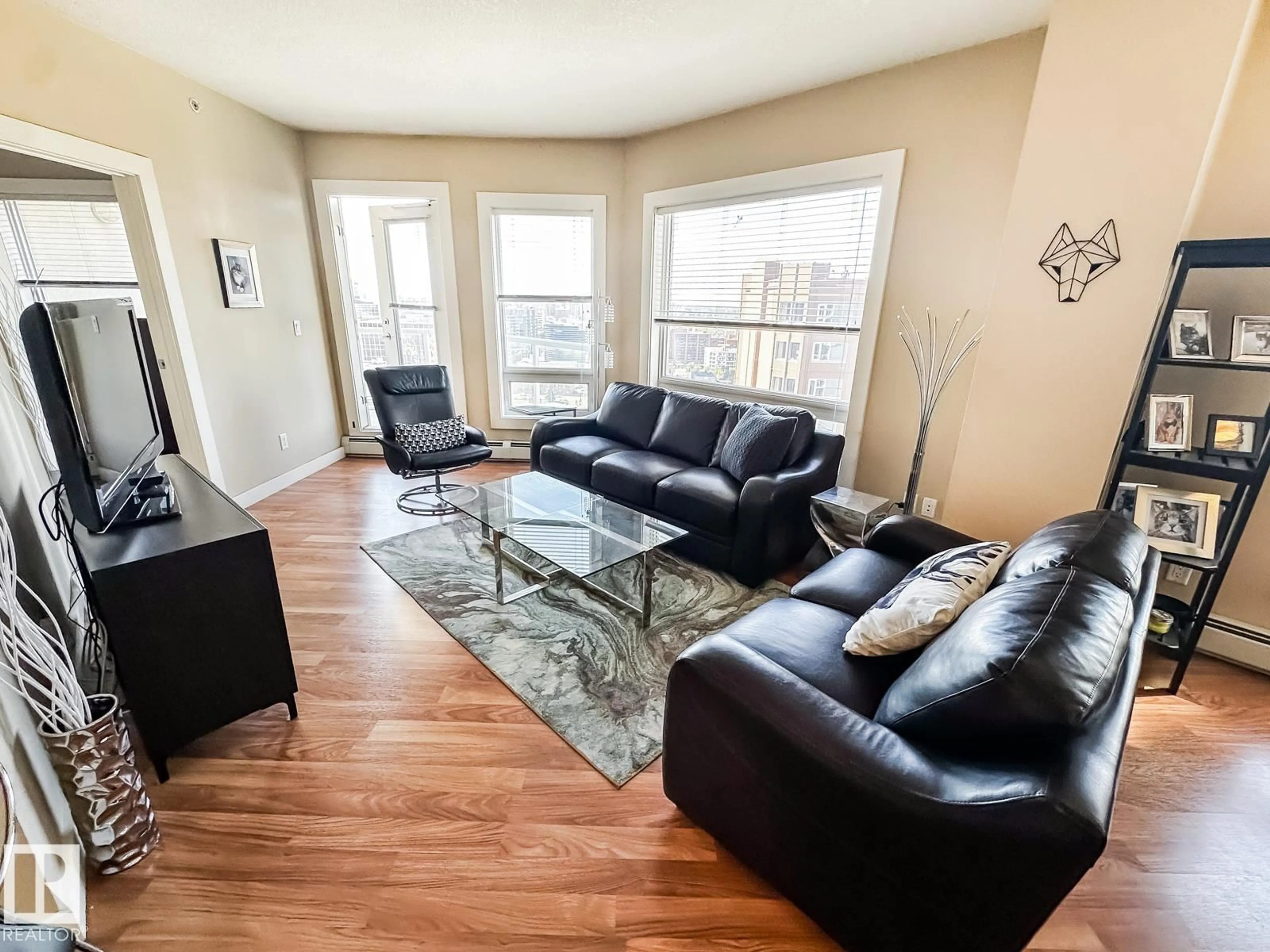 Living room with furniture, wood/laminate floor for 10136 - 1901 104 ST NW, Edmonton Alberta T5J0B5