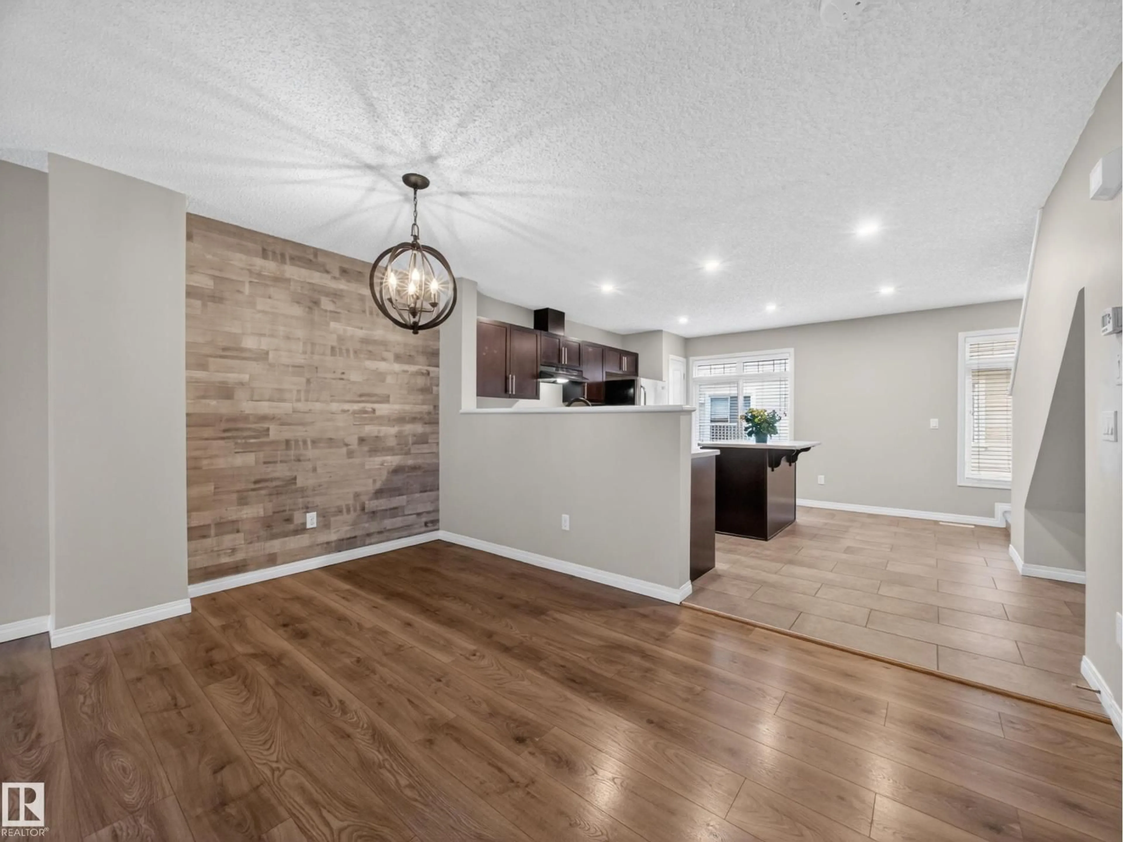 Open concept kitchen, wood/laminate floor for #31 - 1804 70 ST, Edmonton Alberta T6X0H4