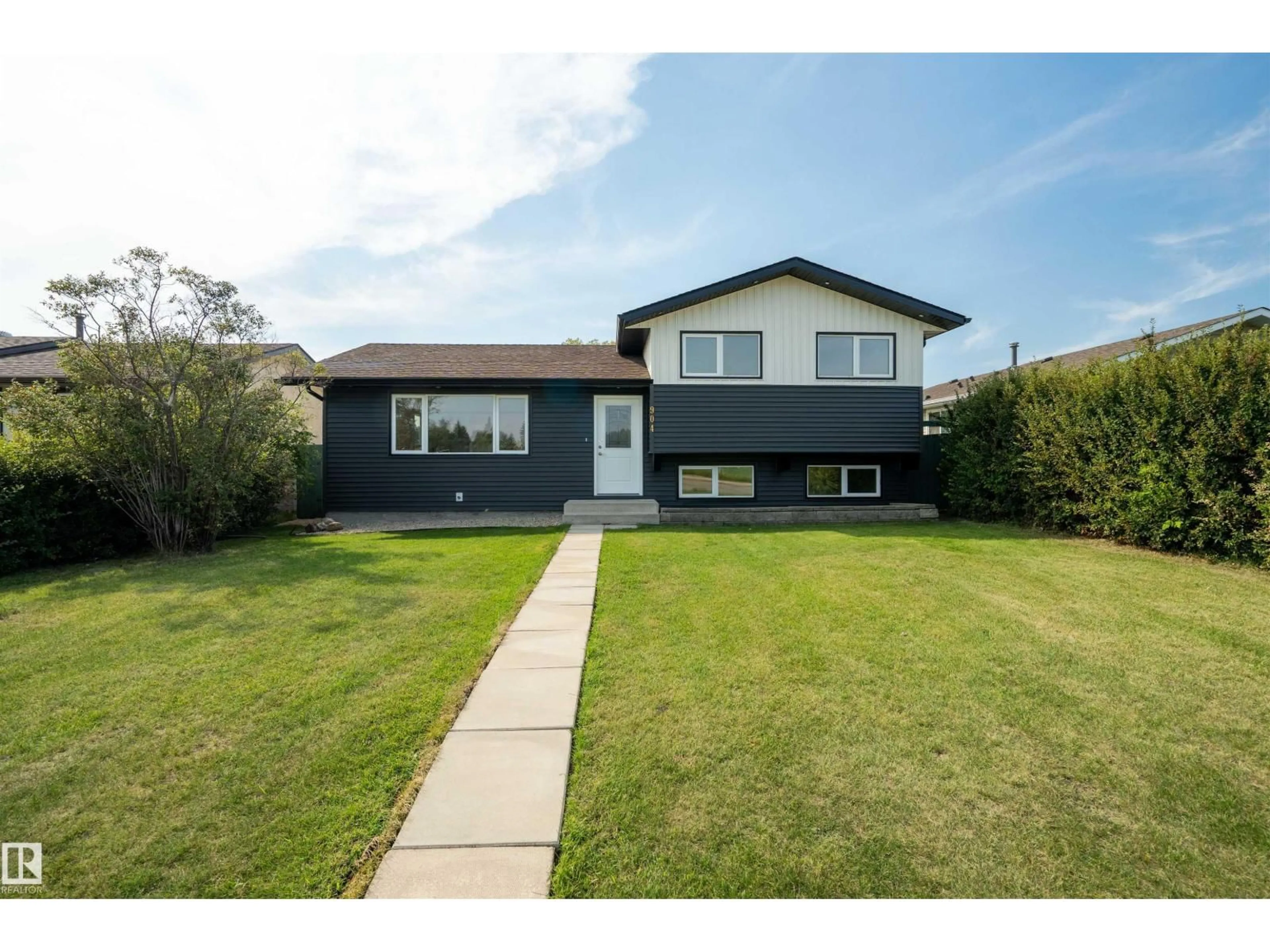 Home with vinyl exterior material, street for NW - 904 KNOTTWOOD S, Edmonton Alberta T6K3C3