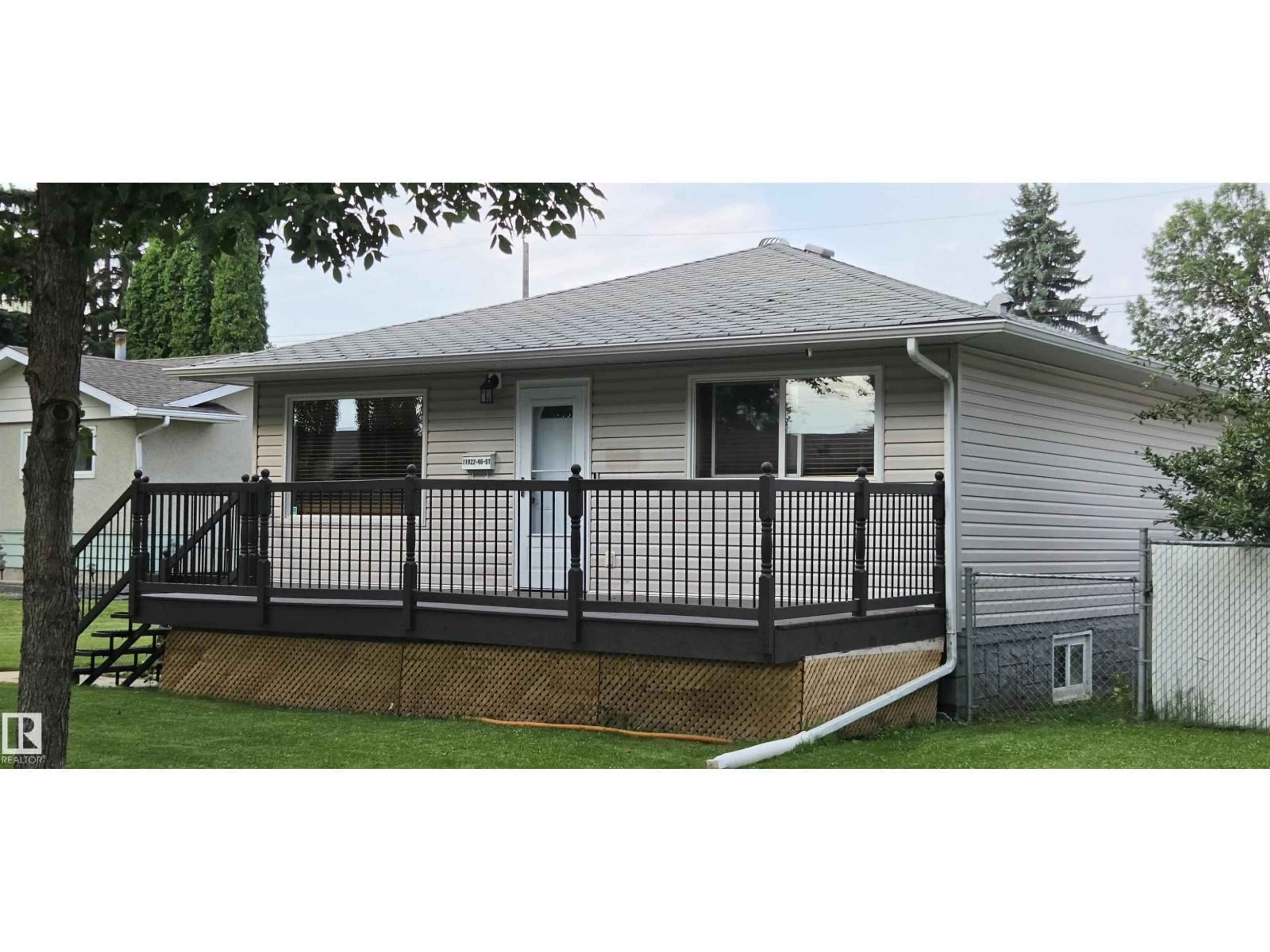 Home with vinyl exterior material, street for 11922 46 ST, Edmonton Alberta T5W2V9