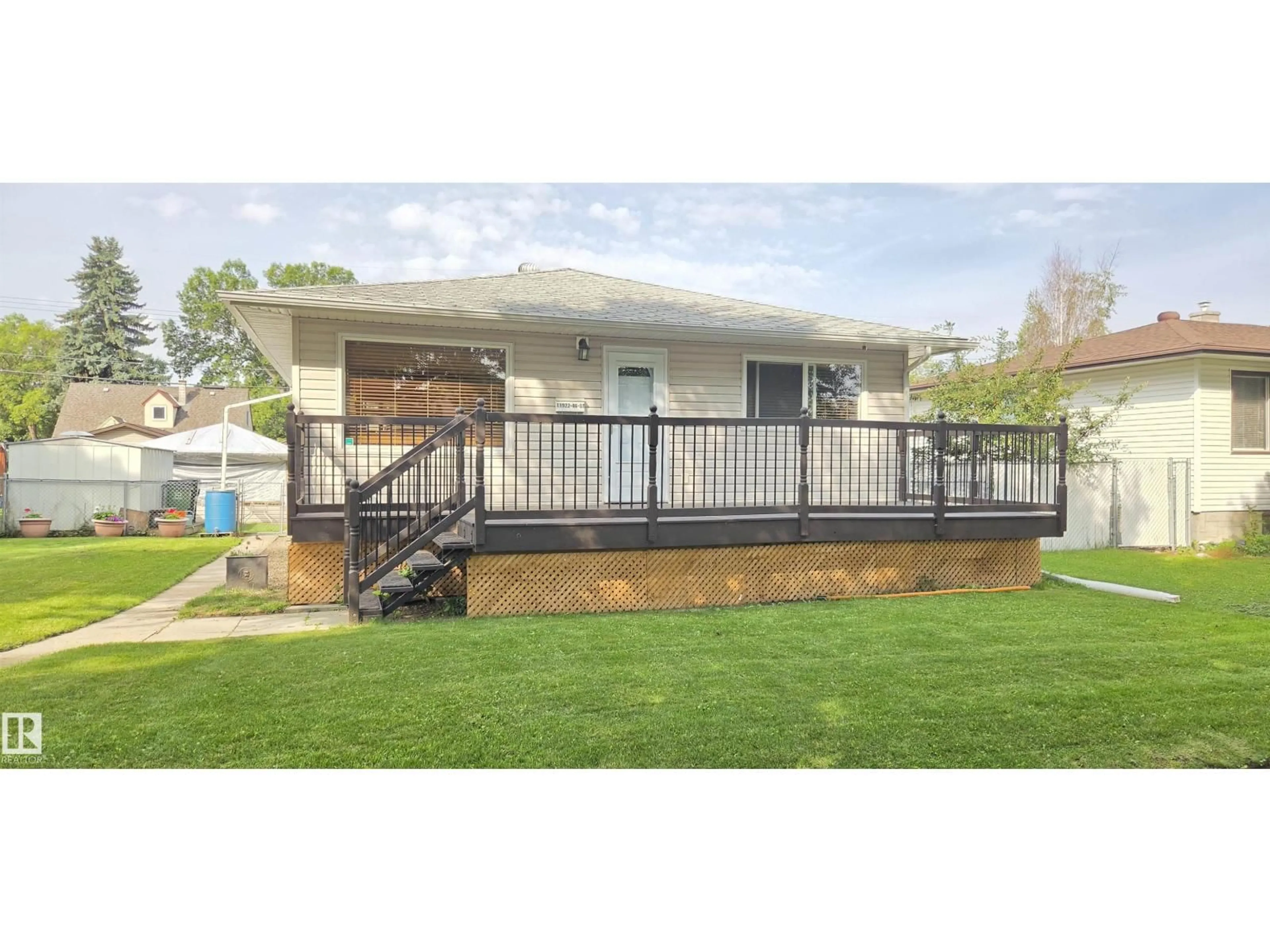 Home with vinyl exterior material, street for 11922 46 ST, Edmonton Alberta T5W2V9