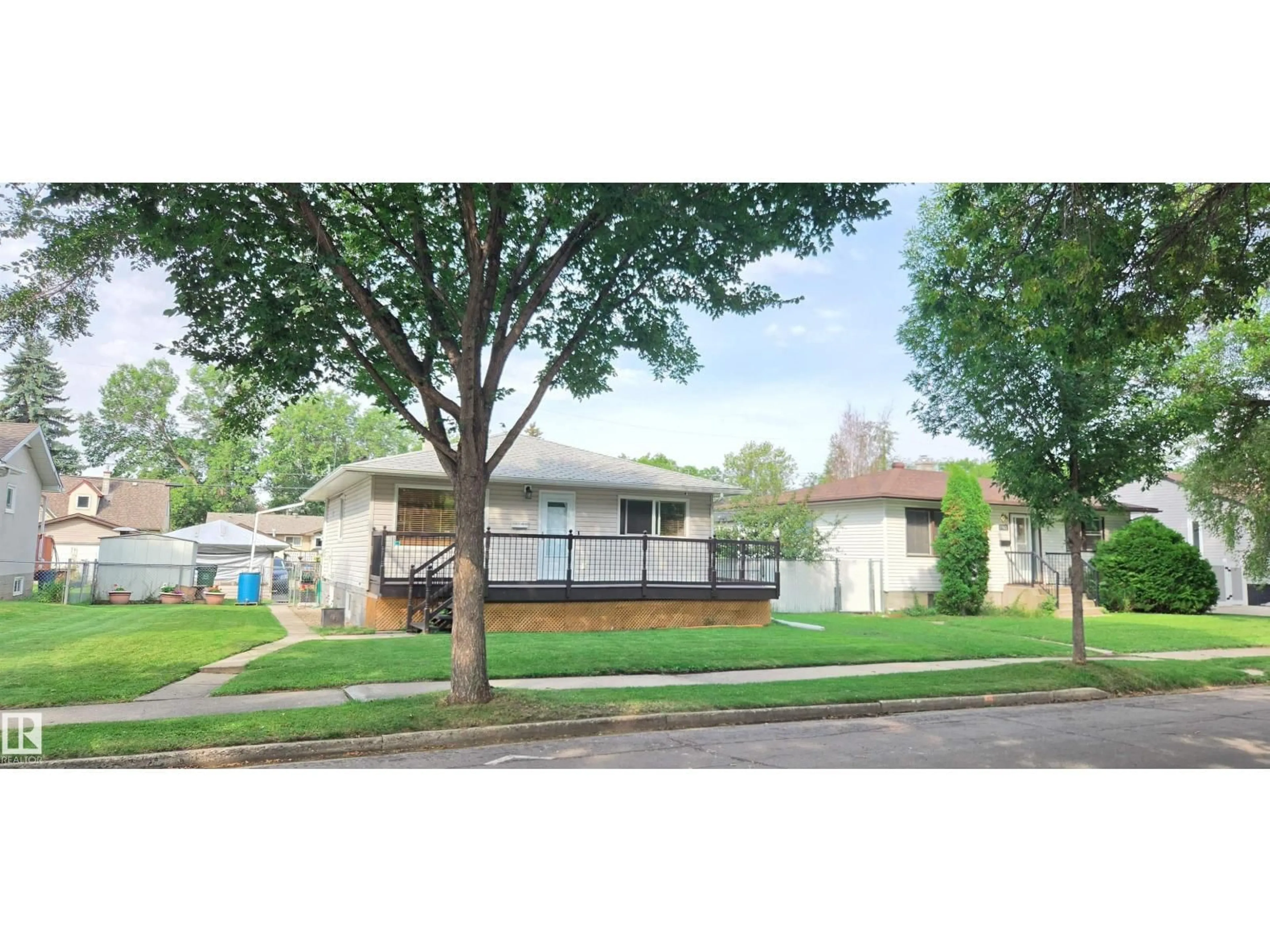 Home with vinyl exterior material, street for 11922 46 ST, Edmonton Alberta T5W2V9