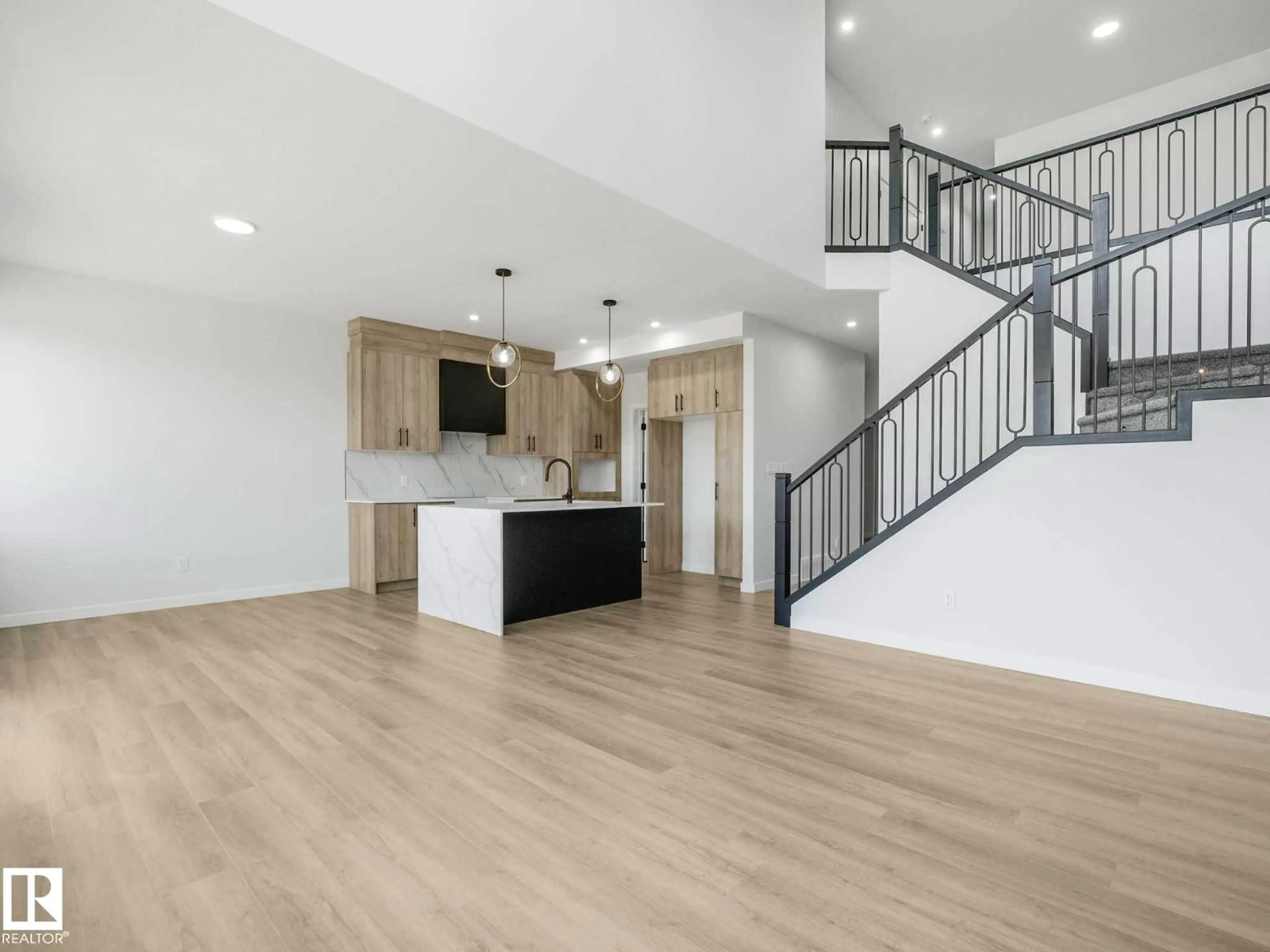 Open concept kitchen, wood/laminate floor for 270 MUNN WY, Leduc Alberta T9E1V1