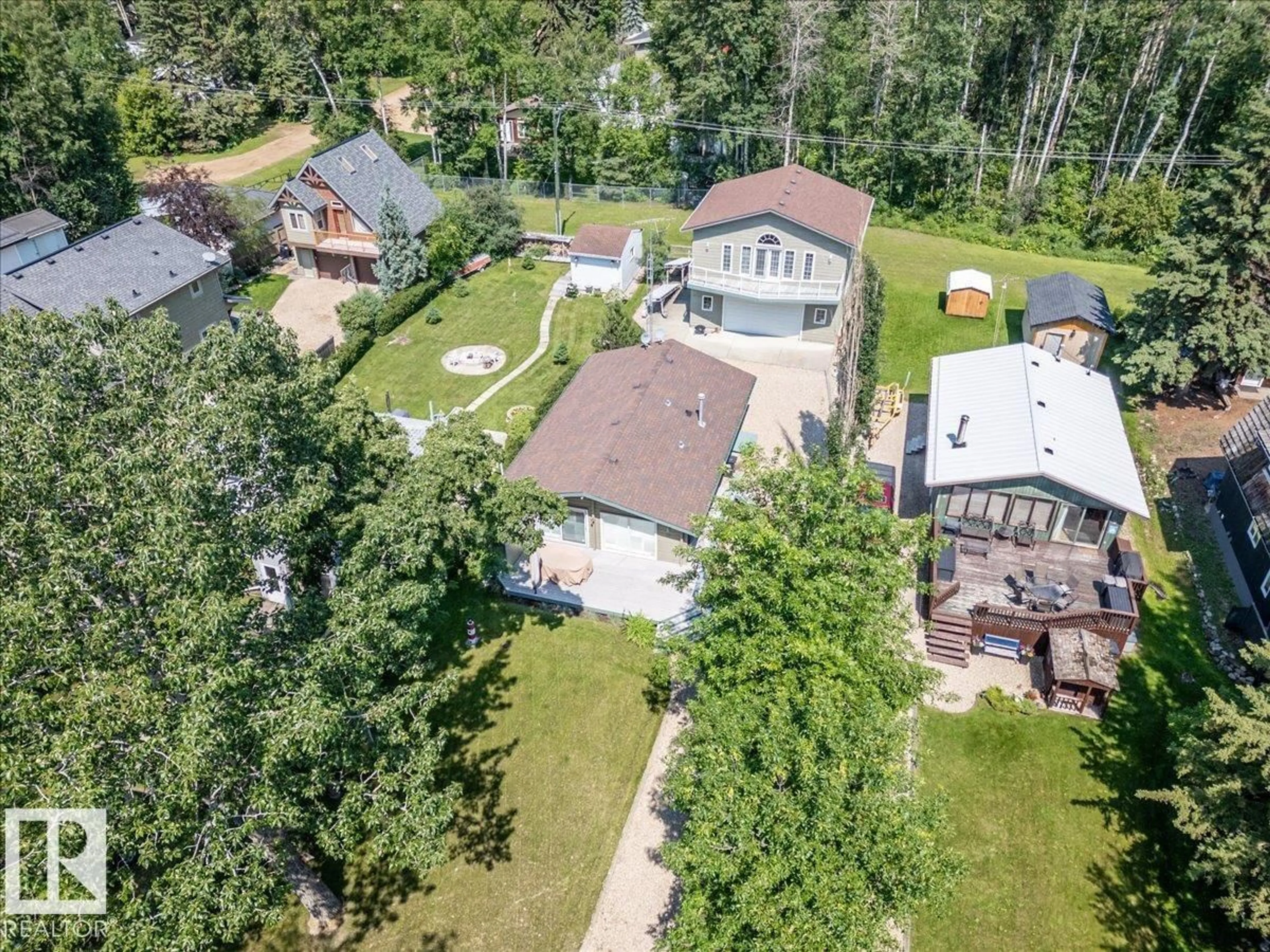 A pic from outside/outdoor area/front of a property/back of a property/a pic from drone, street for 16 LAKESHORE DR, Rural Leduc County Alberta T0C2C0