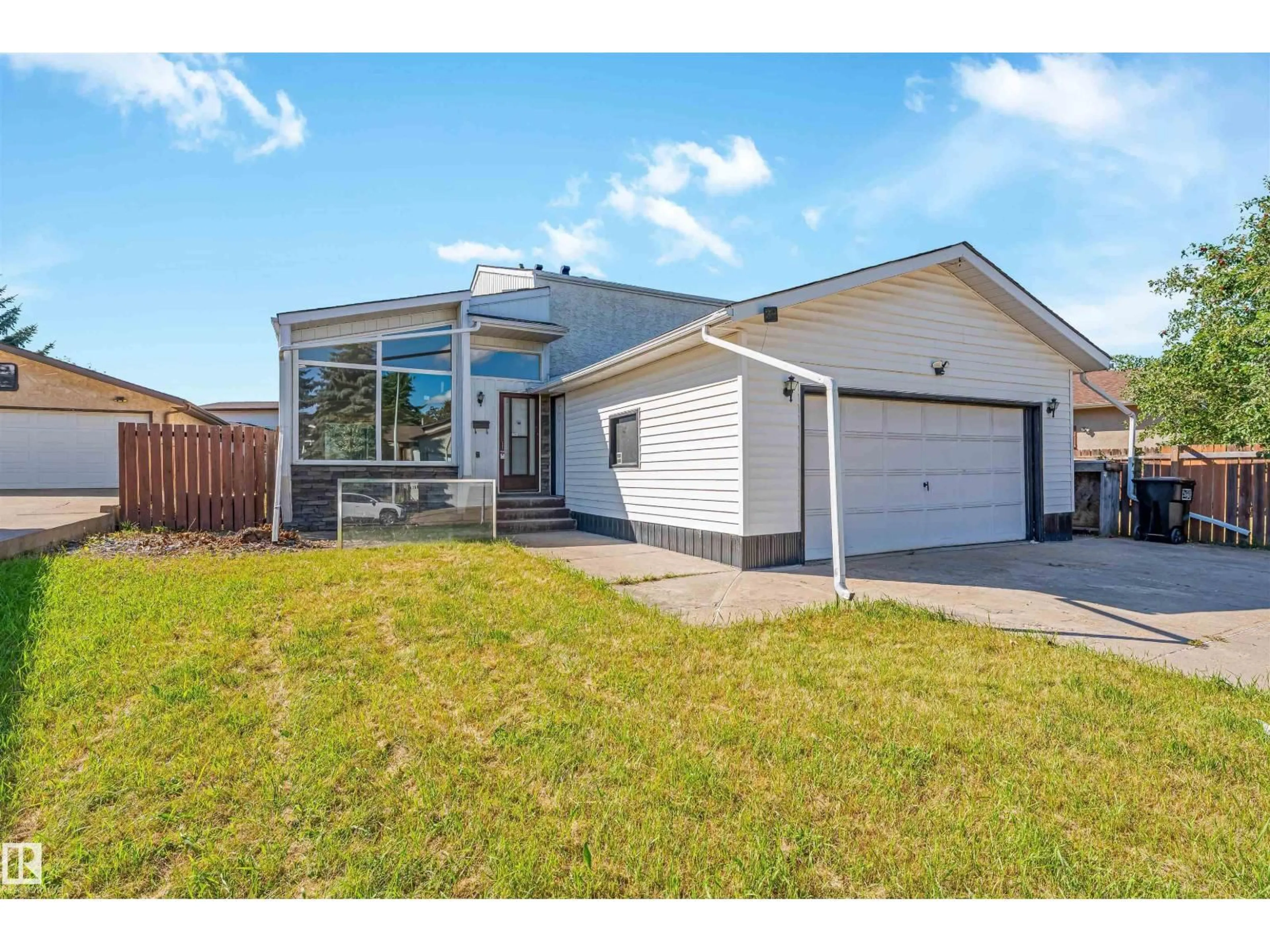 Home with vinyl exterior material, street for NW - 1768 48A ST, Edmonton Alberta T6L2Y1