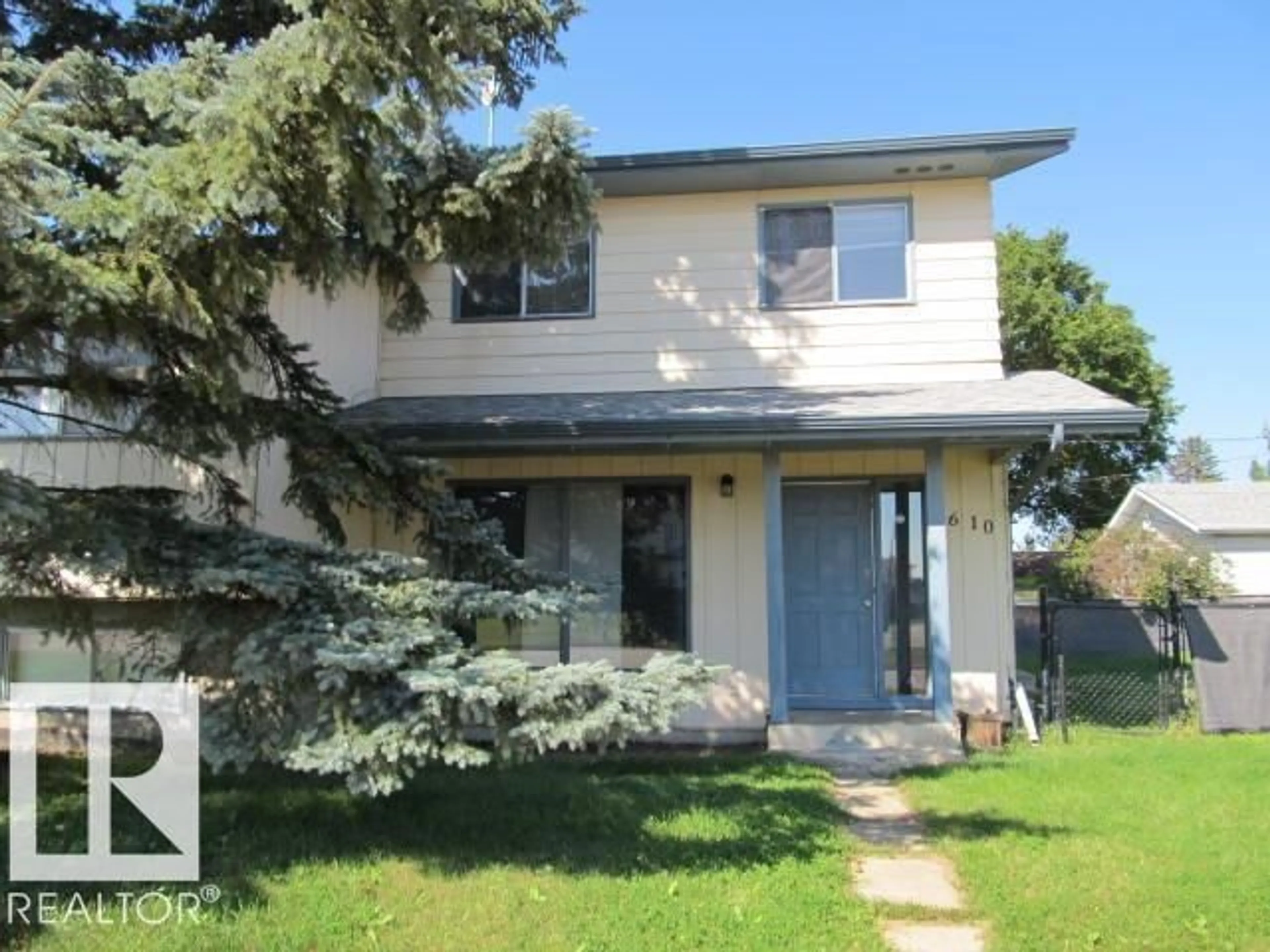Home with vinyl exterior material, street for 5608-5610 47 ST, Tofield Alberta T0B4J0