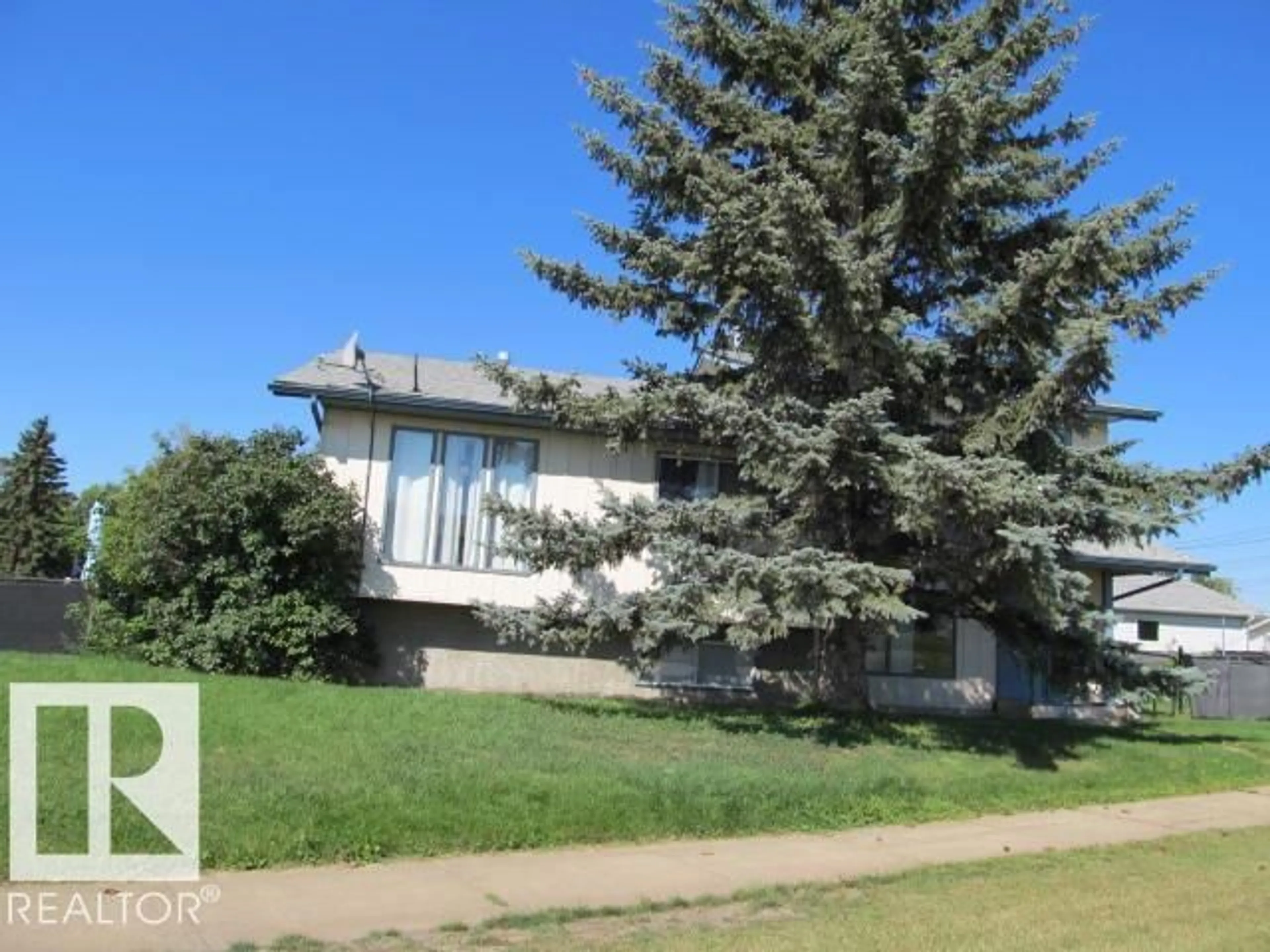 Home with vinyl exterior material, street for 5608-5610 47 ST, Tofield Alberta T0B4J0