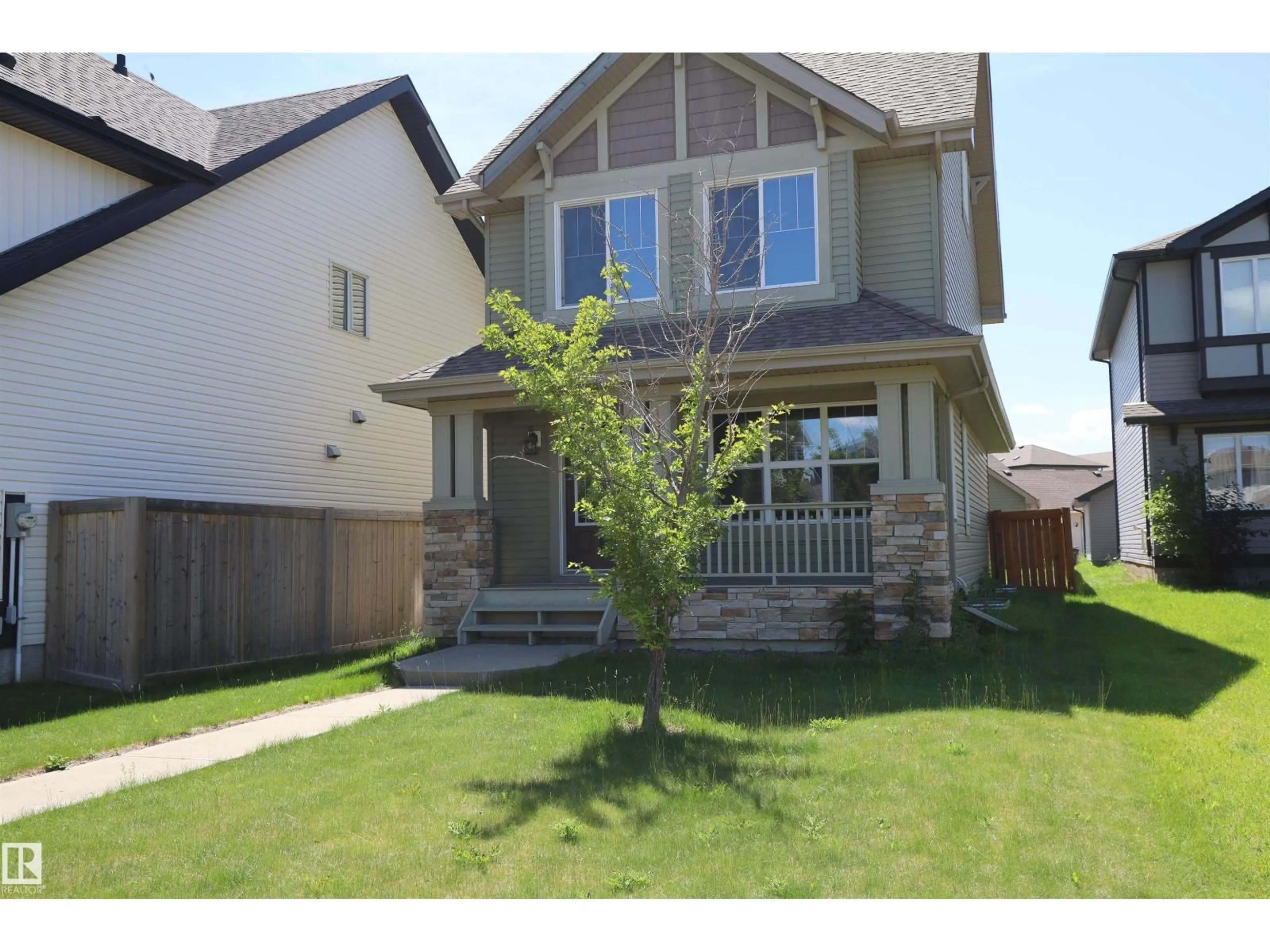 Home with vinyl exterior material, street for 4044 ALEXANDER WY, Edmonton Alberta T6W2C6