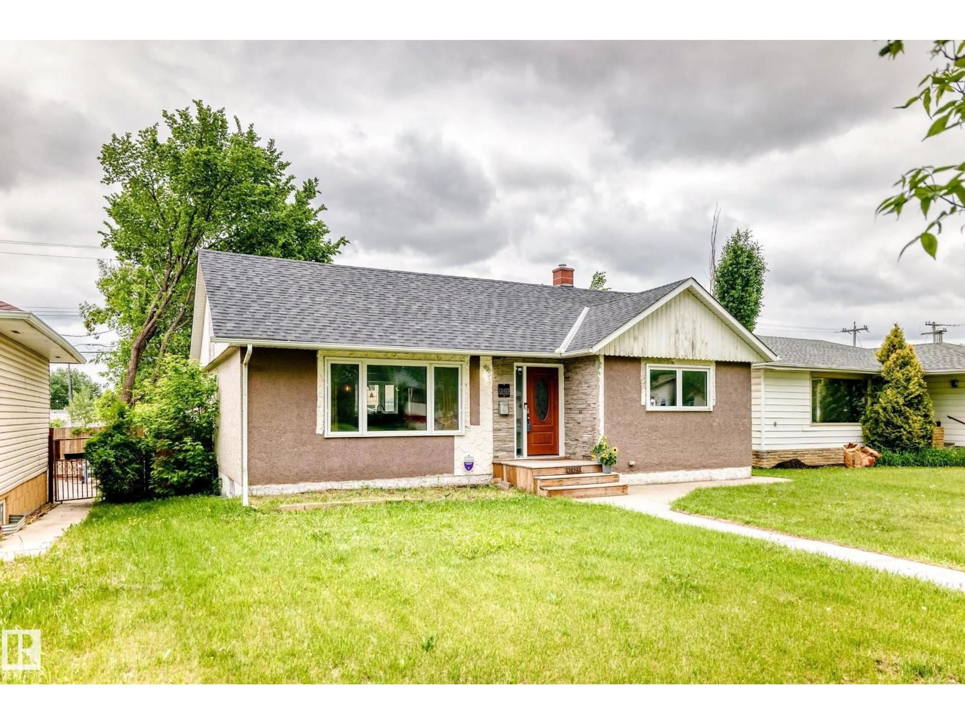 Home with vinyl exterior material, street for NW - 12423 75 ST, Edmonton Alberta T5B2C1