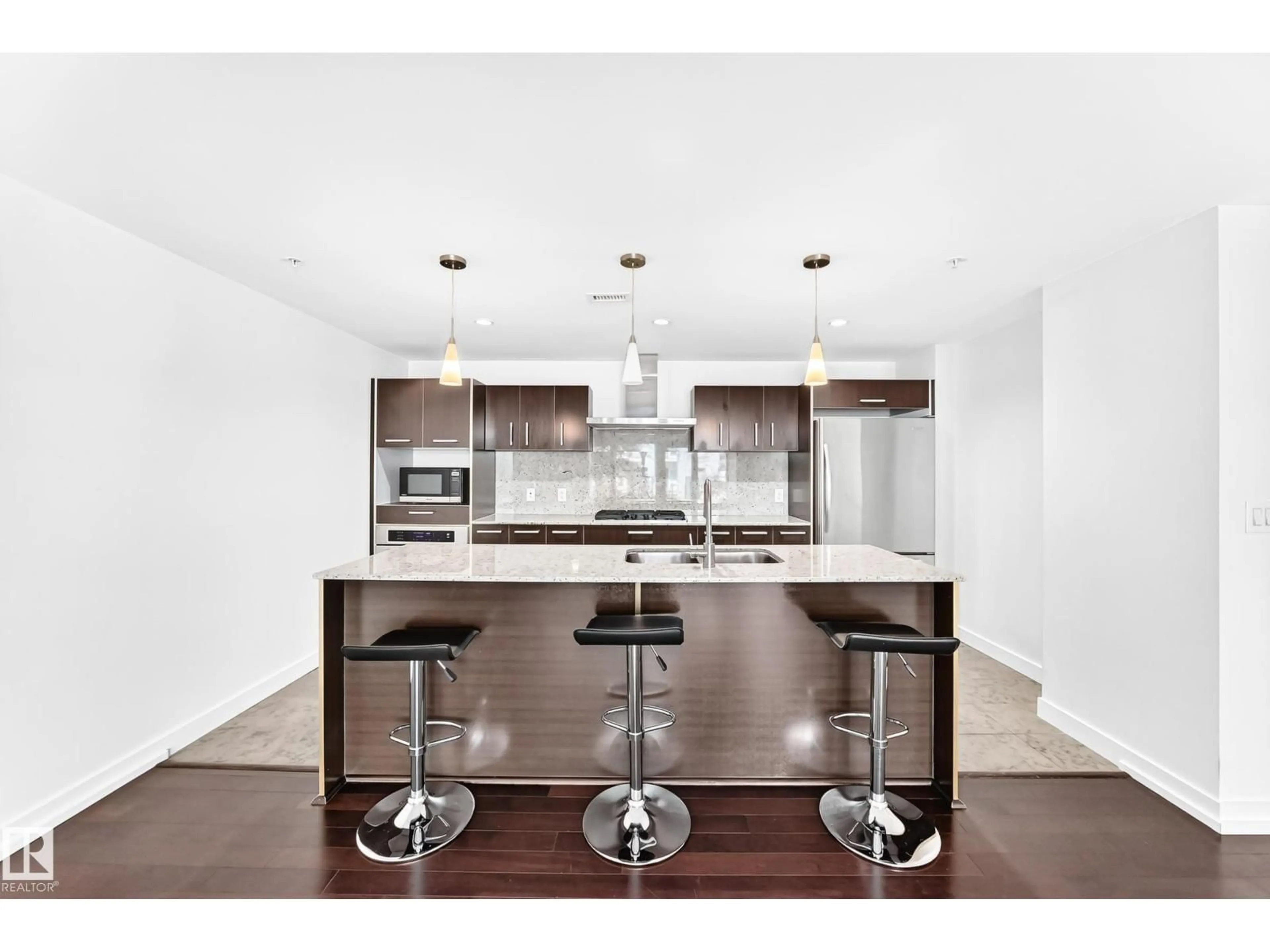 Open concept kitchen, wood/laminate floor for #104 - 2612 109 ST, Edmonton Alberta T6J3S9