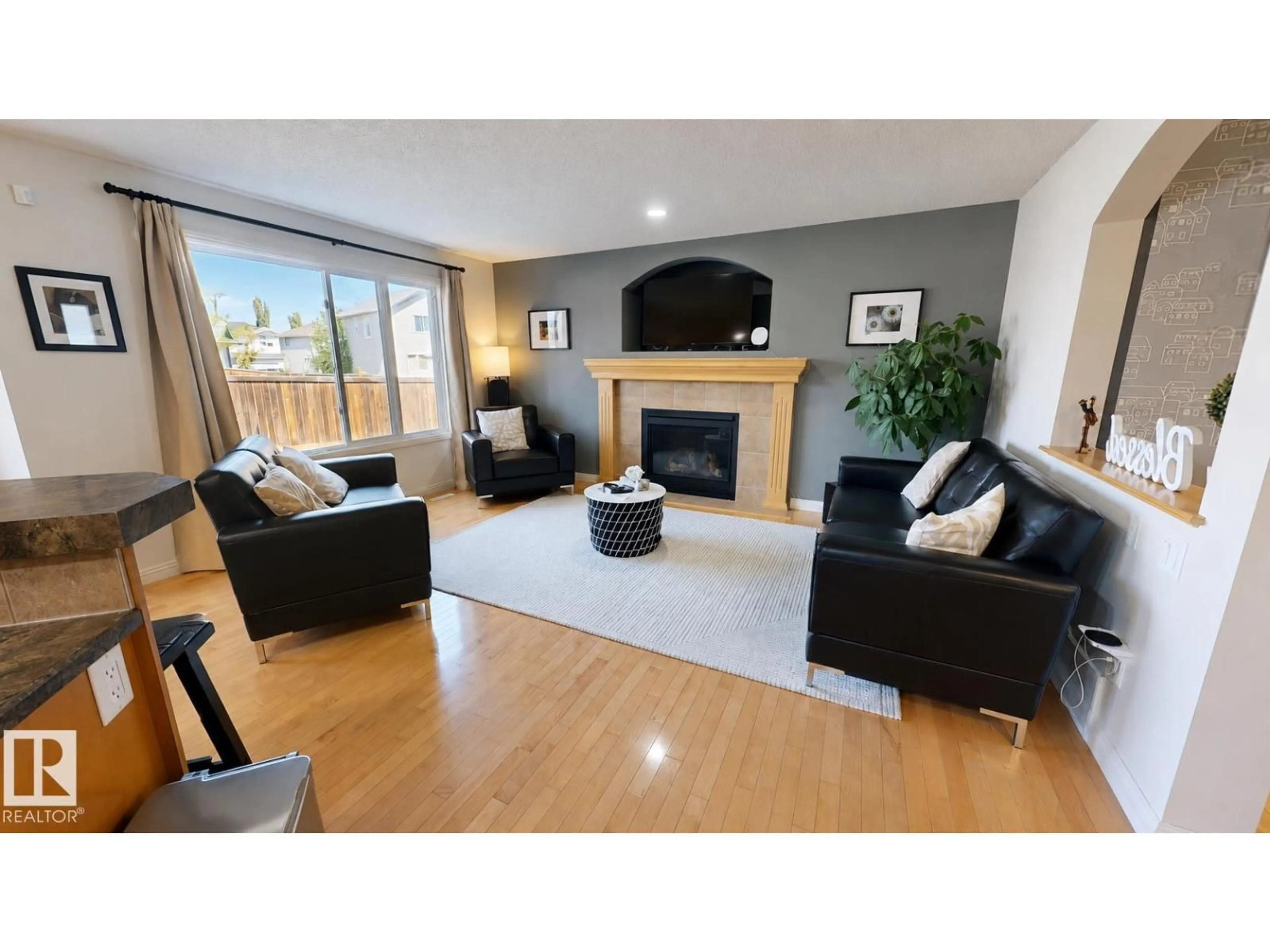 Living room with furniture, wood/laminate floor for NW - 14528 141 ST, Edmonton Alberta T6V1Y1