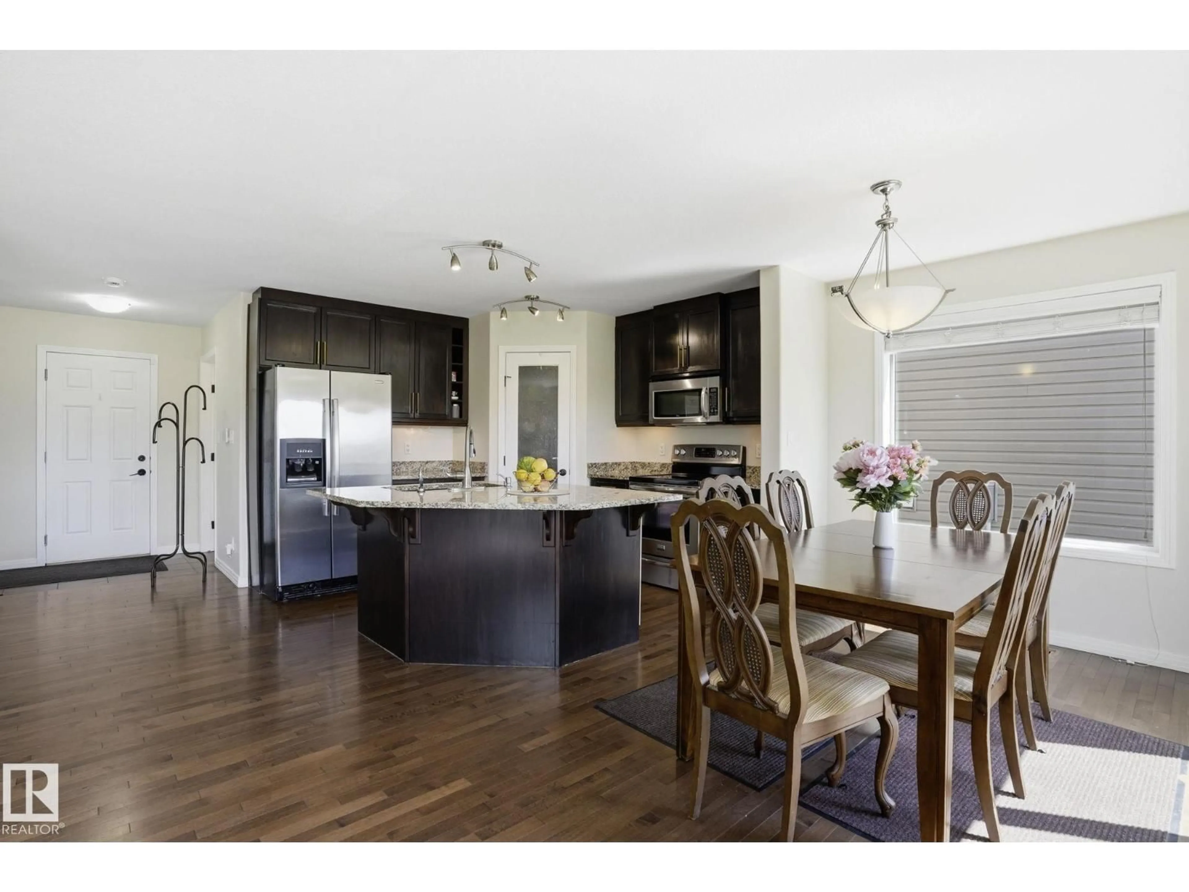 Open concept kitchen, wood/laminate floor for 10 ROCKWELL CL, Fort Saskatchewan Alberta T8L0E7