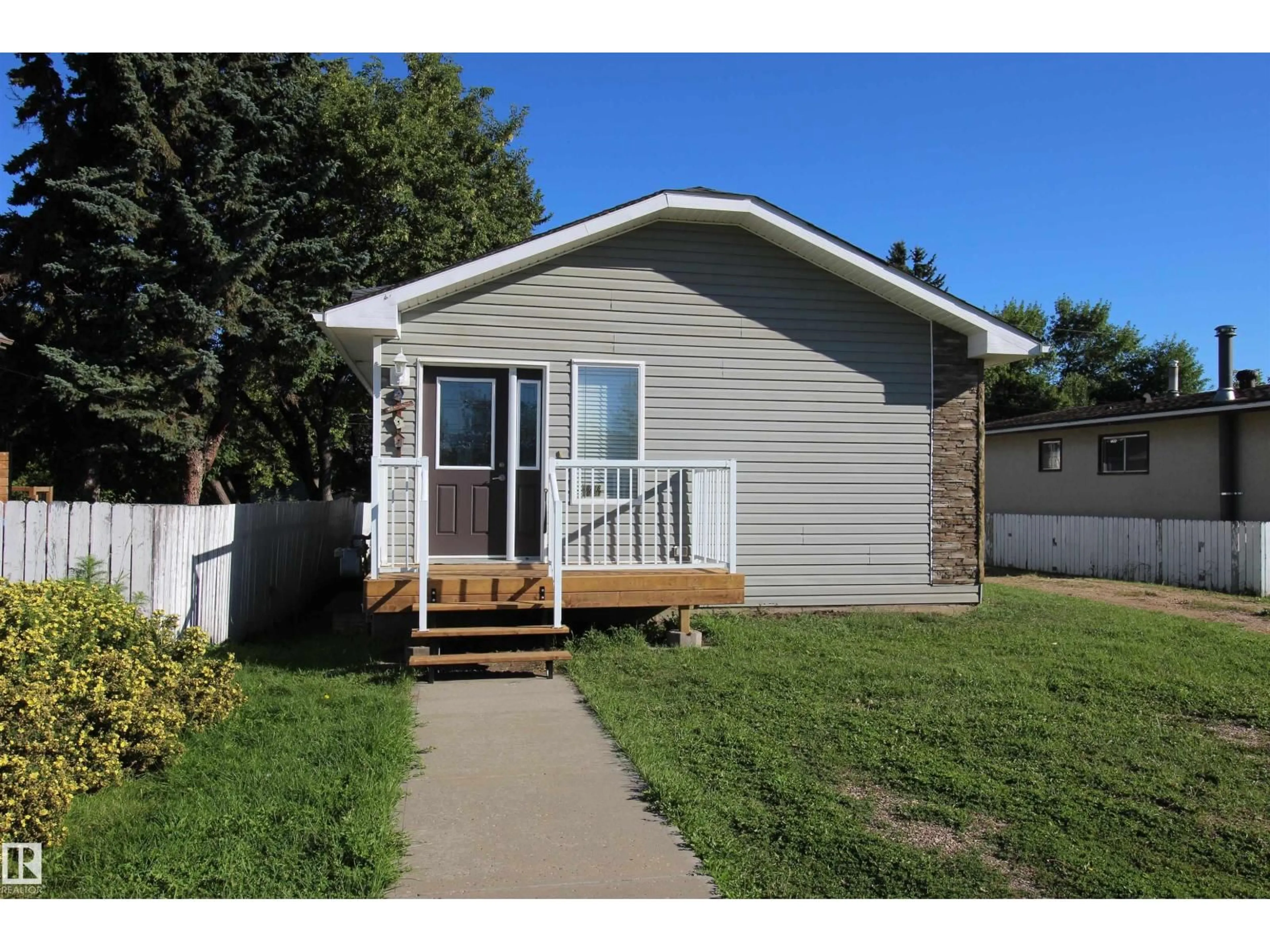 Home with vinyl exterior material, street for 10216 101 ST, Westlock Alberta T7P1X9