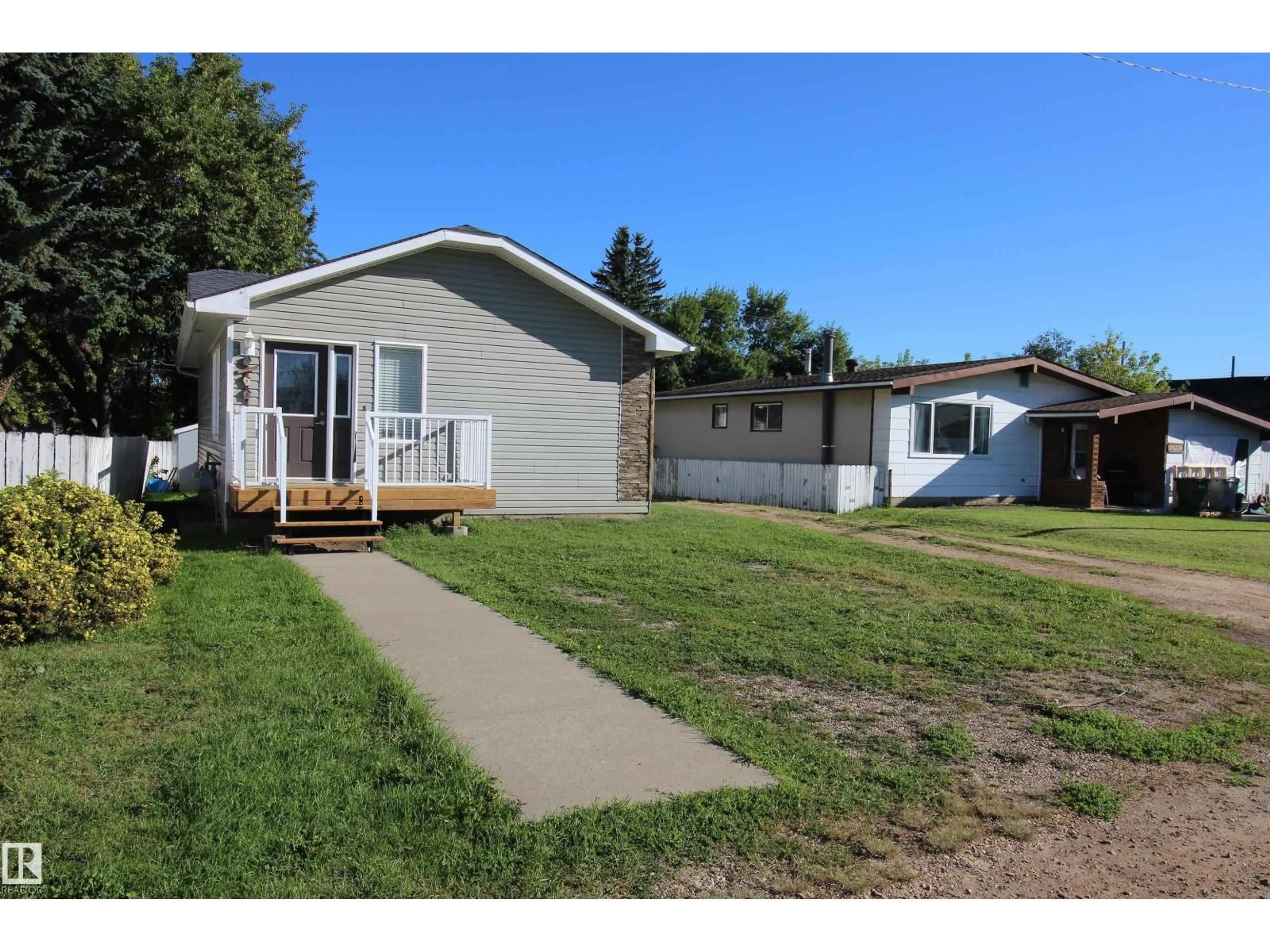 Home with vinyl exterior material, street for 10216 101 ST, Westlock Alberta T7P1X9