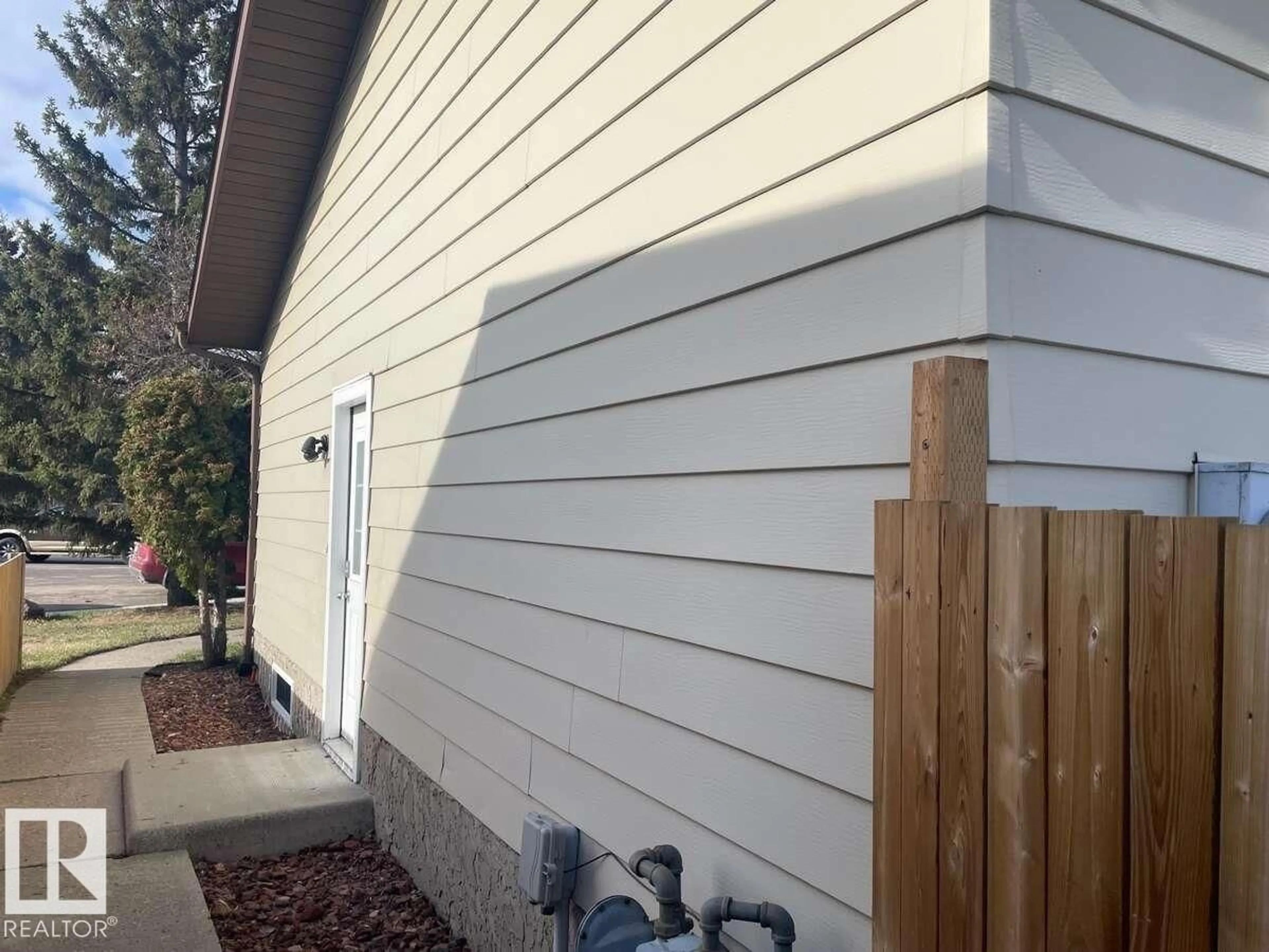 Home with vinyl exterior material, street for NW - 1929 65 ST, Edmonton Alberta T6L1M1
