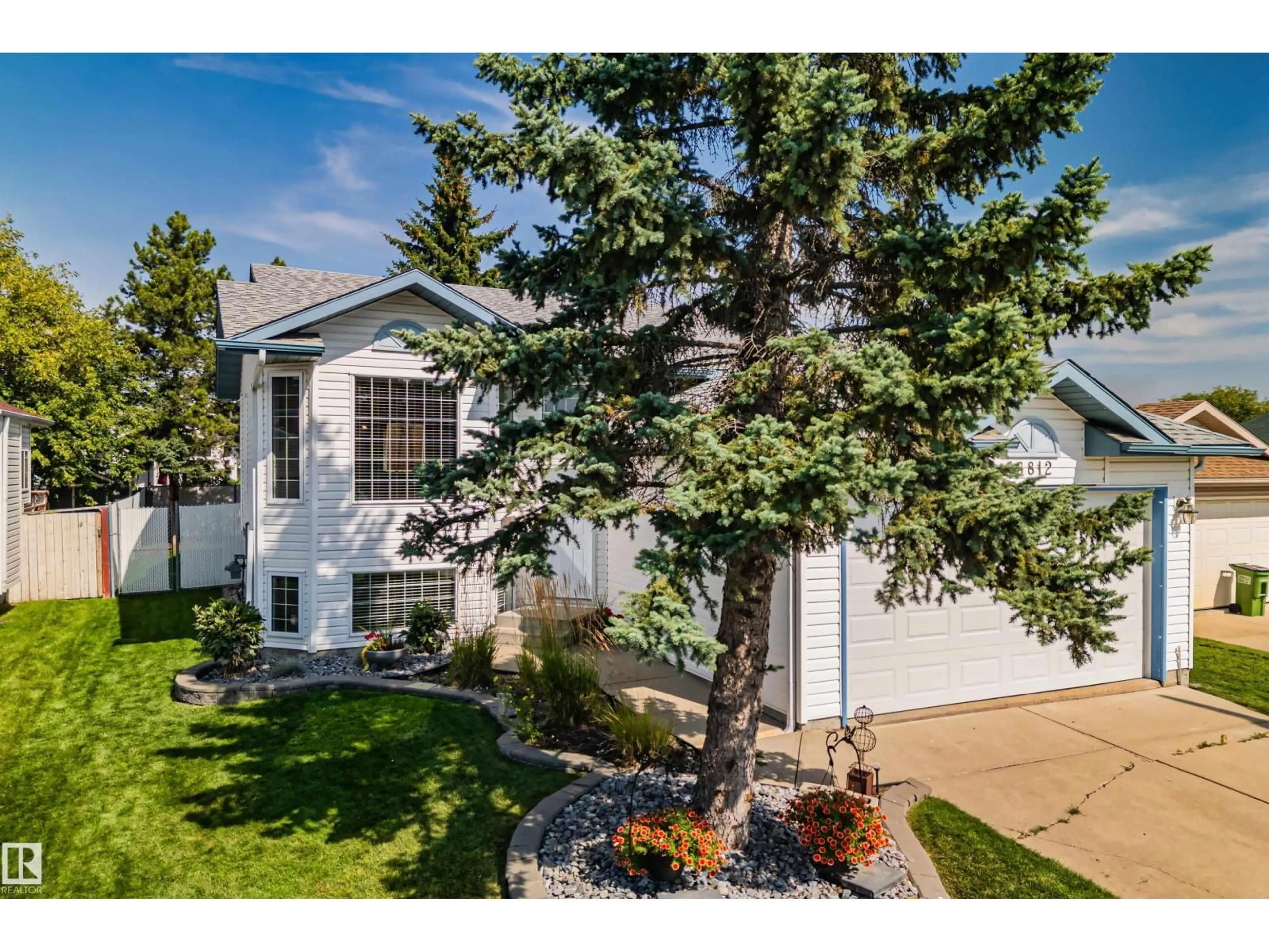 Home with vinyl exterior material, street for 18812 89 AV, Edmonton Alberta T5T5Z8