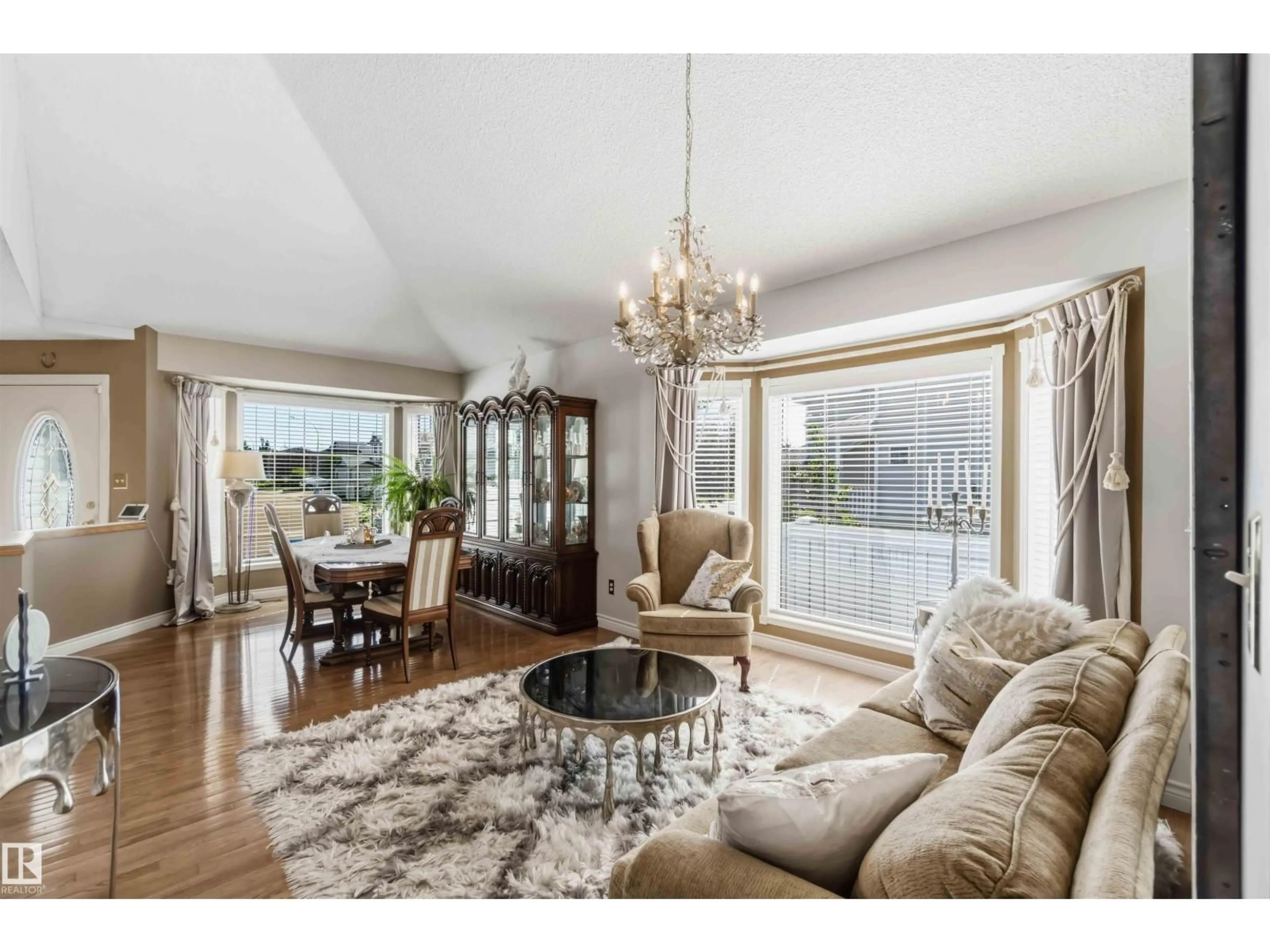 Living room with furniture, wood/laminate floor for 522 KLARVATTEN LAKE WD, Edmonton Alberta T5Z3E4