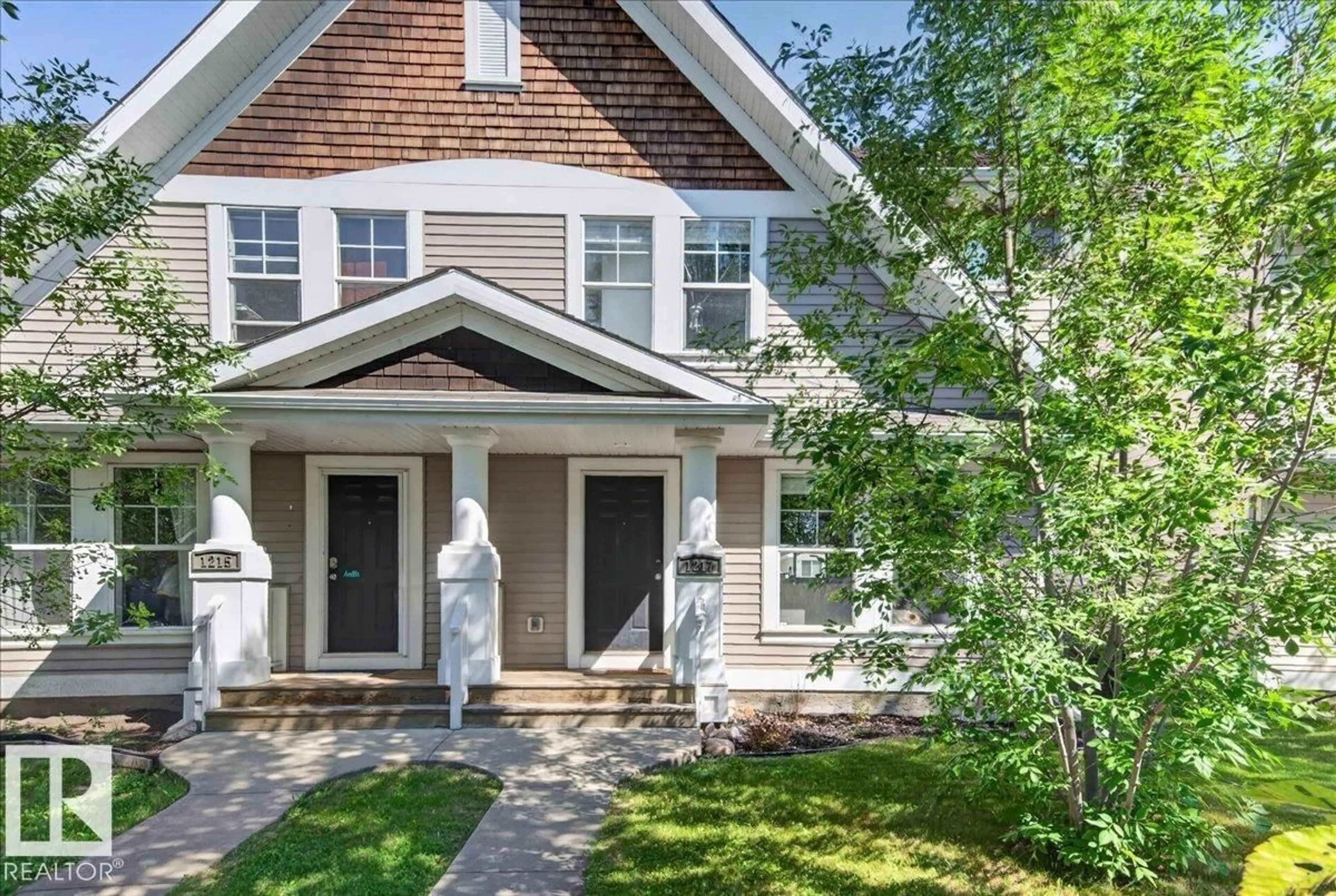 Home with vinyl exterior material, street for 1217 76 STREET, Edmonton Alberta T6X1M9