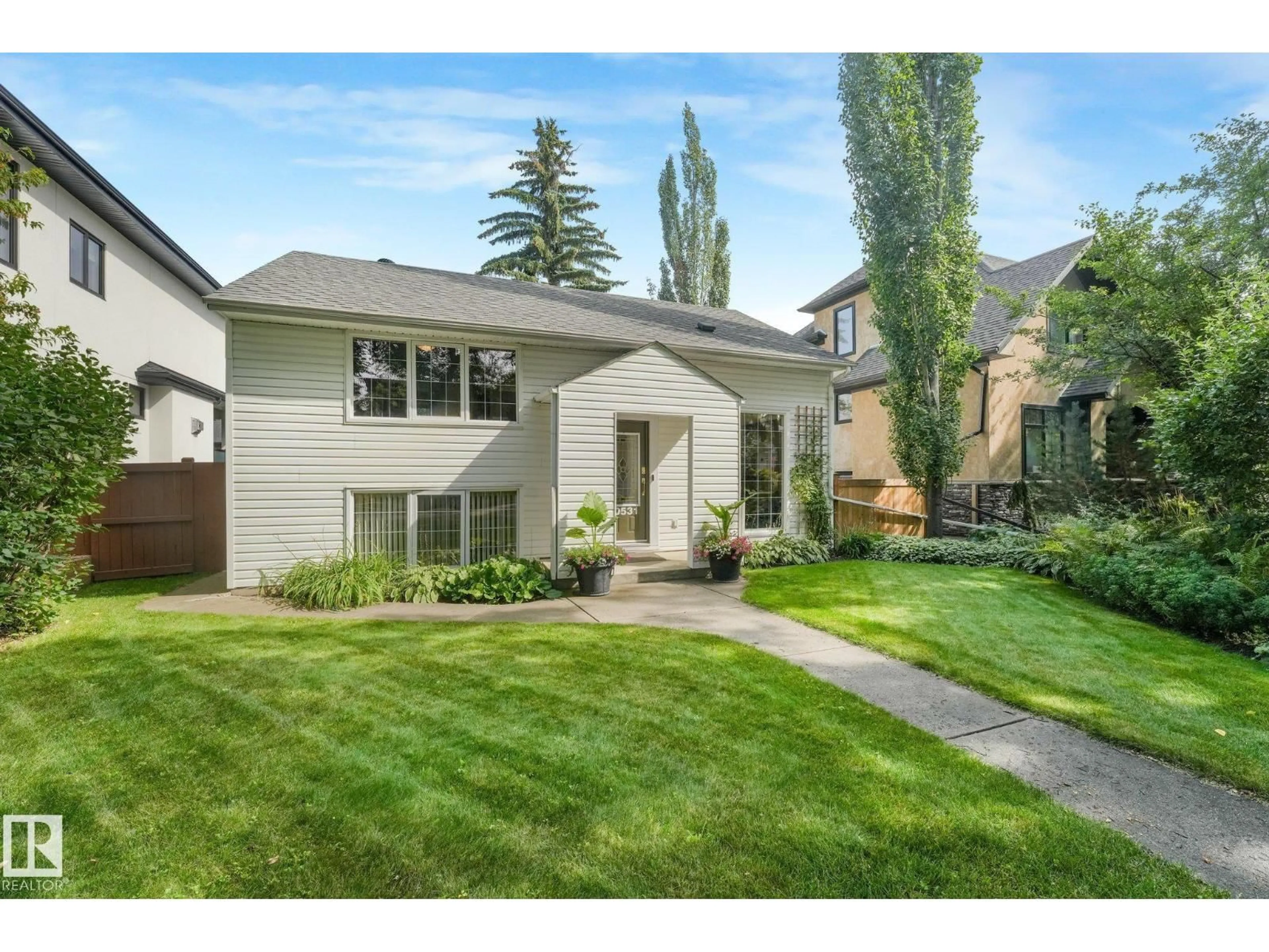 Home with vinyl exterior material, street for NW - 10531 137 ST, Edmonton Alberta T5N2H4