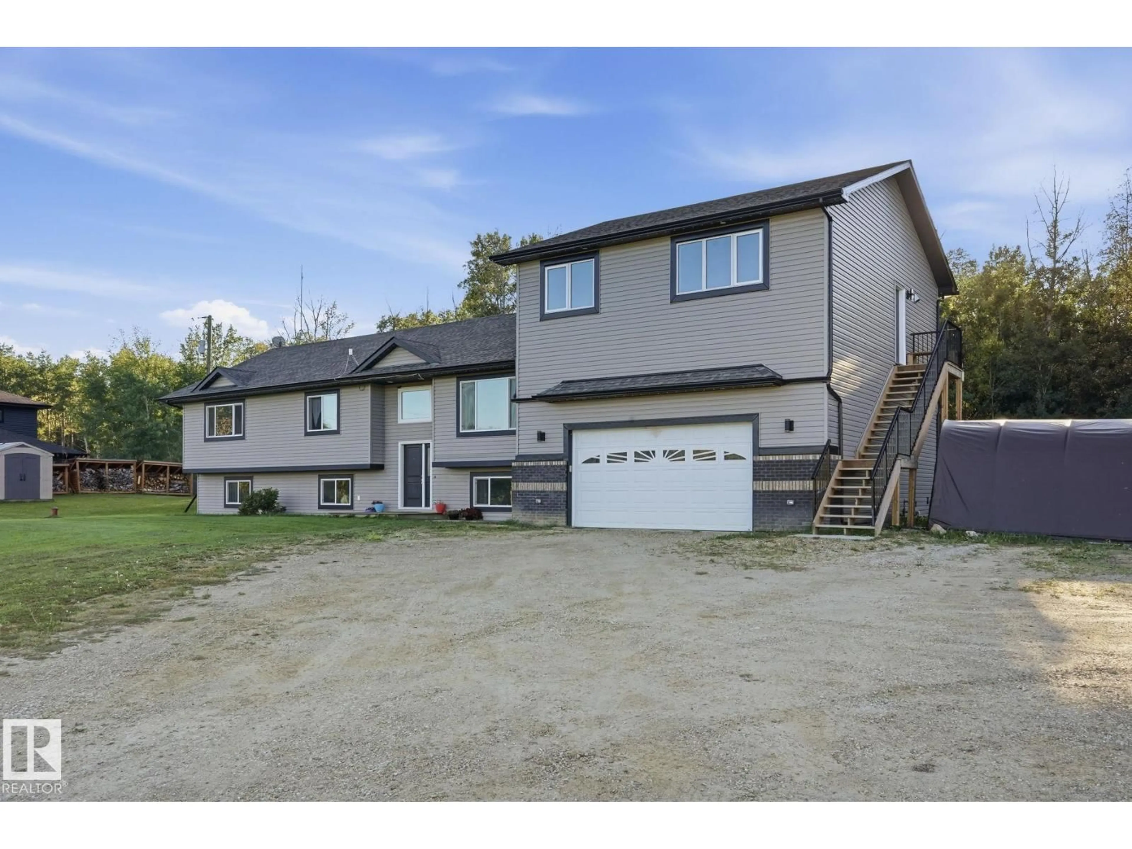A pic from outside/outdoor area/front of a property/back of a property/a pic from drone, street for 54514 - 20 RGE ROAD 12, Rural Lac Ste. Anne County Alberta T0E1V2