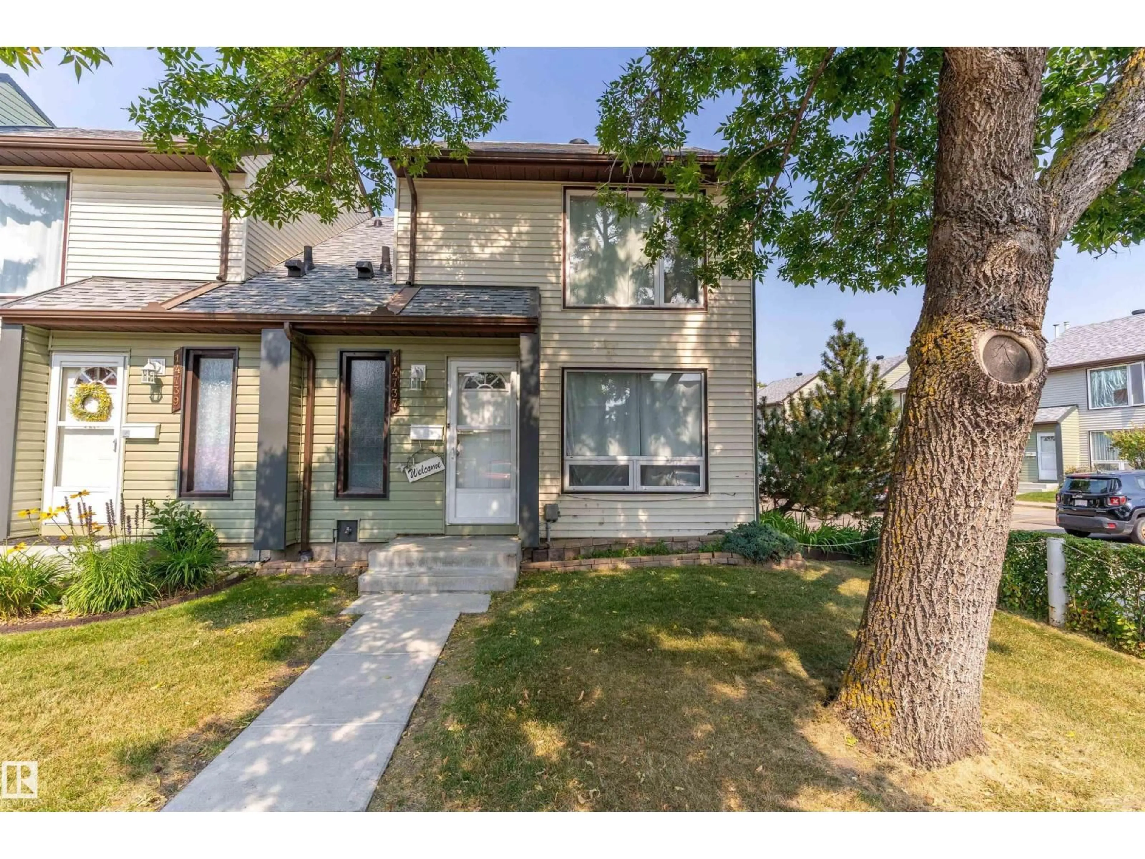 Home with vinyl exterior material, street for NW - 14737 25 ST, Edmonton Alberta T5Y2E8