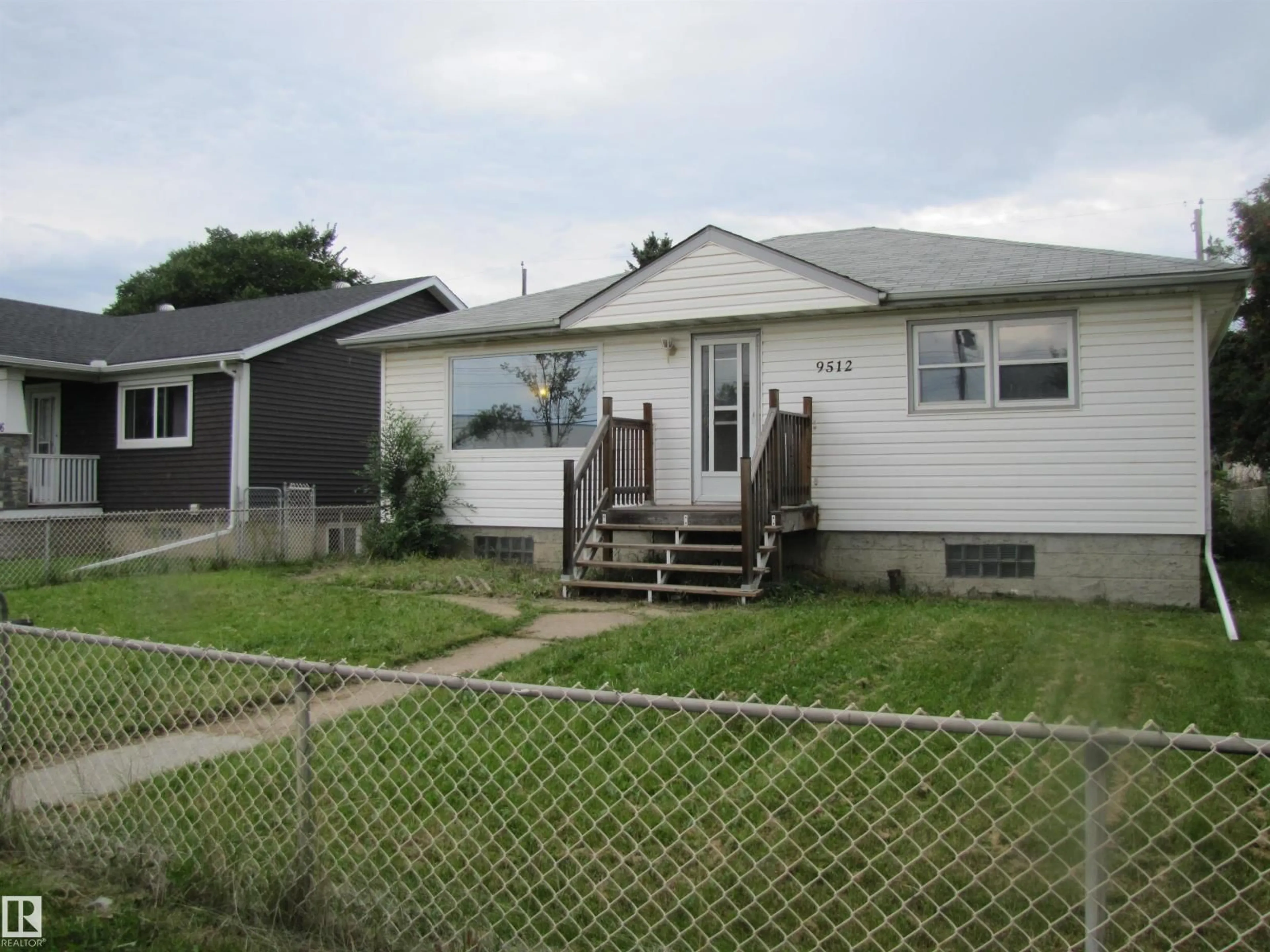 Home with vinyl exterior material, street for NW - 9512 63 AV, Edmonton Alberta T6E0G4