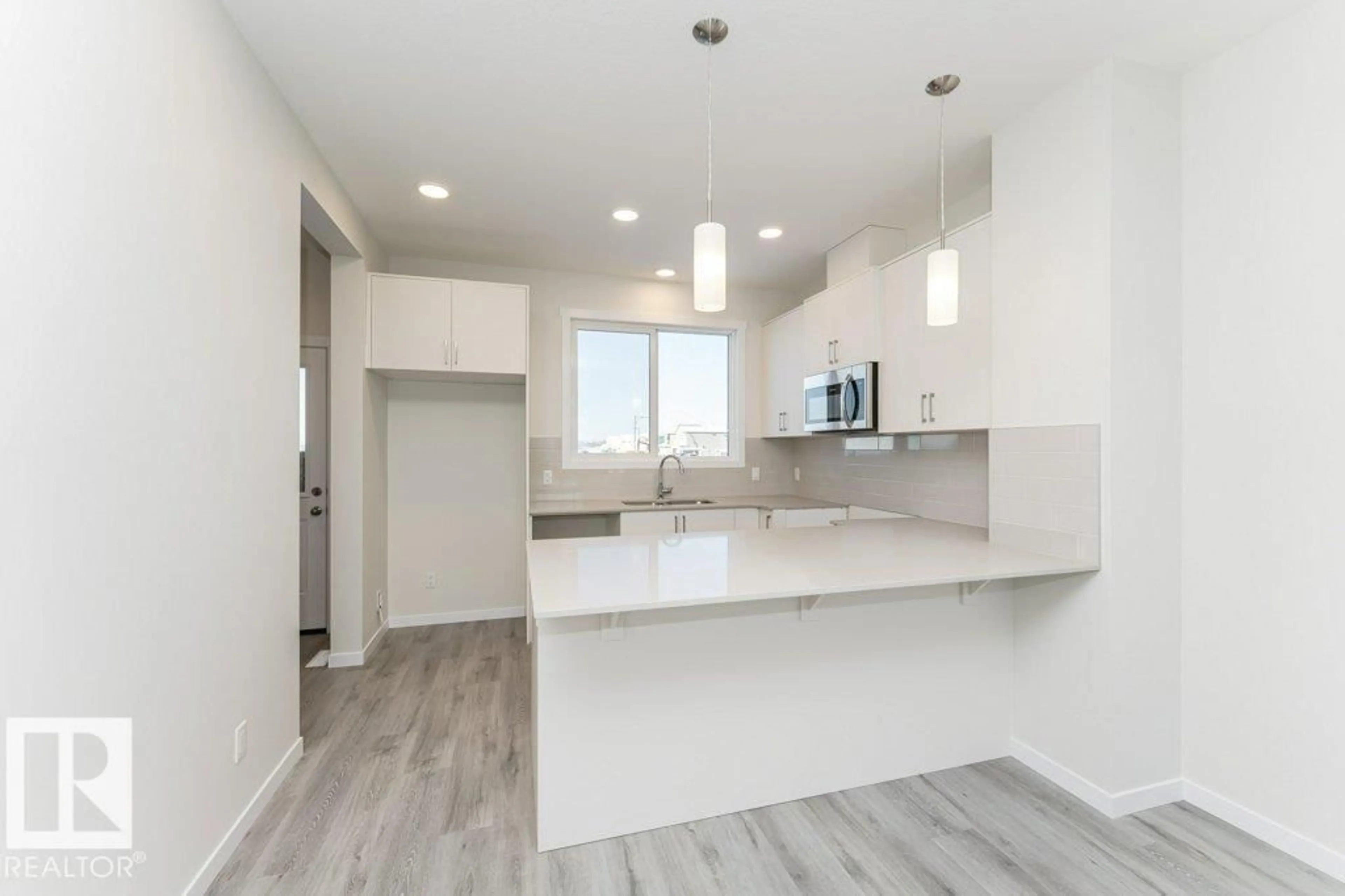 Open concept kitchen, unknown for 6281 175A AV, Edmonton Alberta T5Y4A5