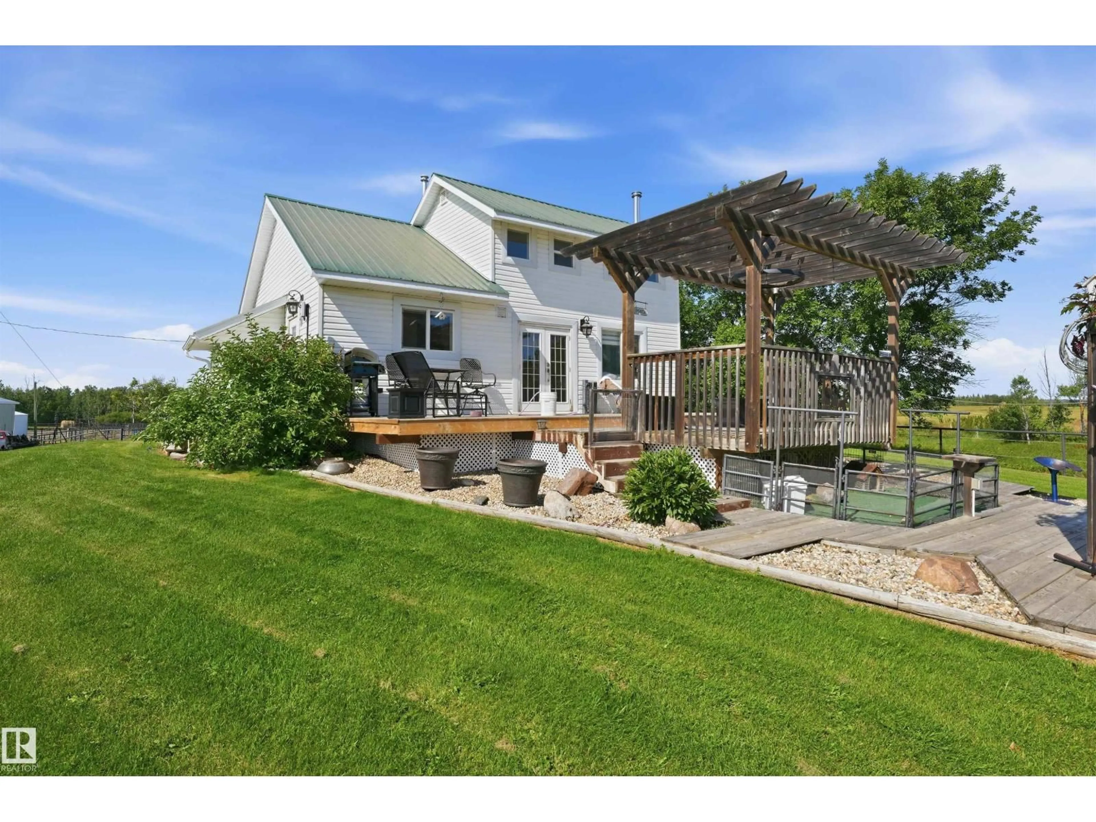 A pic from outside/outdoor area/front of a property/back of a property/a pic from drone, water/lake/river/ocean view for 56502 RGE ROAD 33, Rural Lac Ste. Anne County Alberta T0E1V0