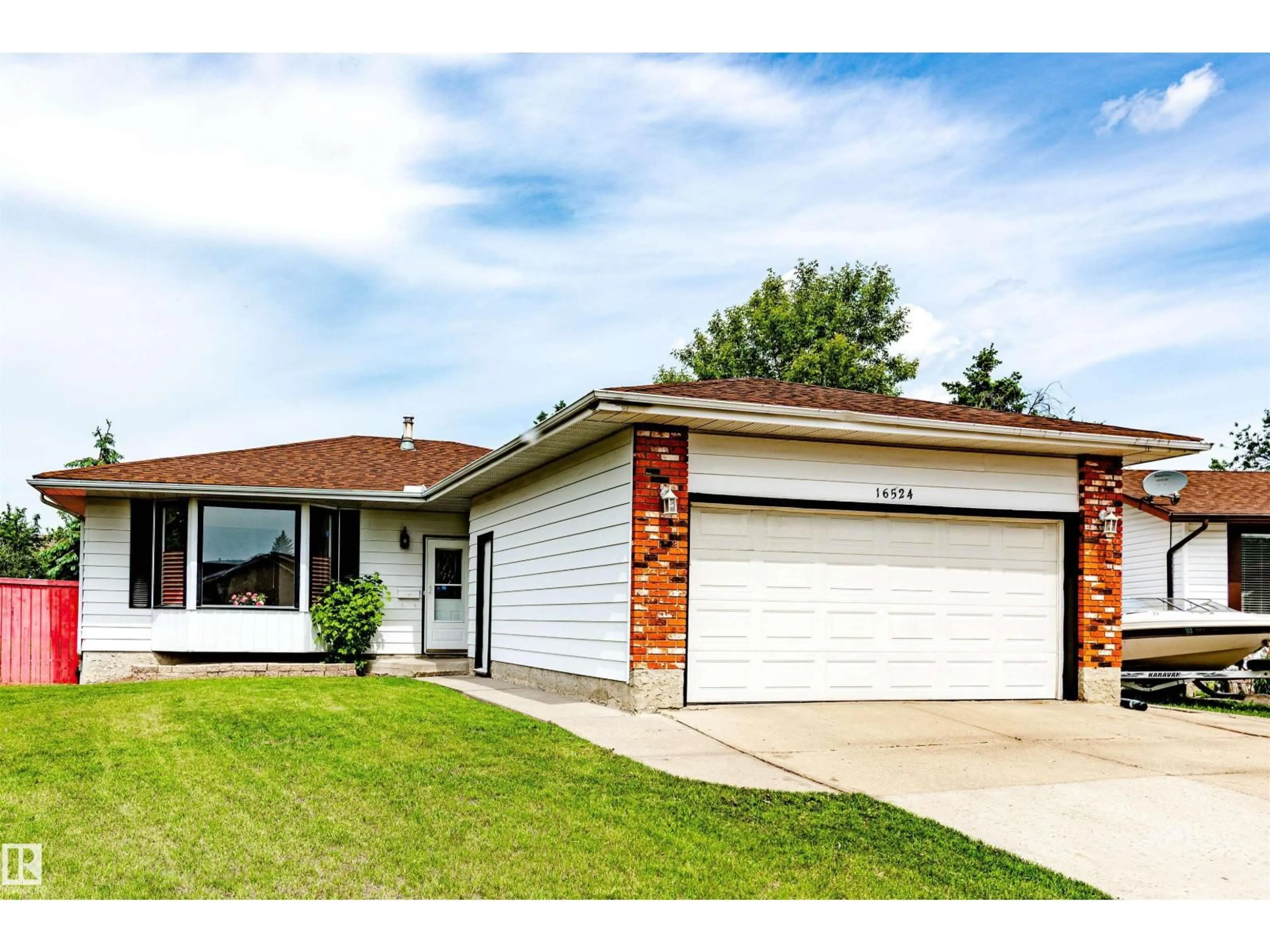 Home with vinyl exterior material, street for NW - 16524 116 ST, Edmonton Alberta T5X3T8
