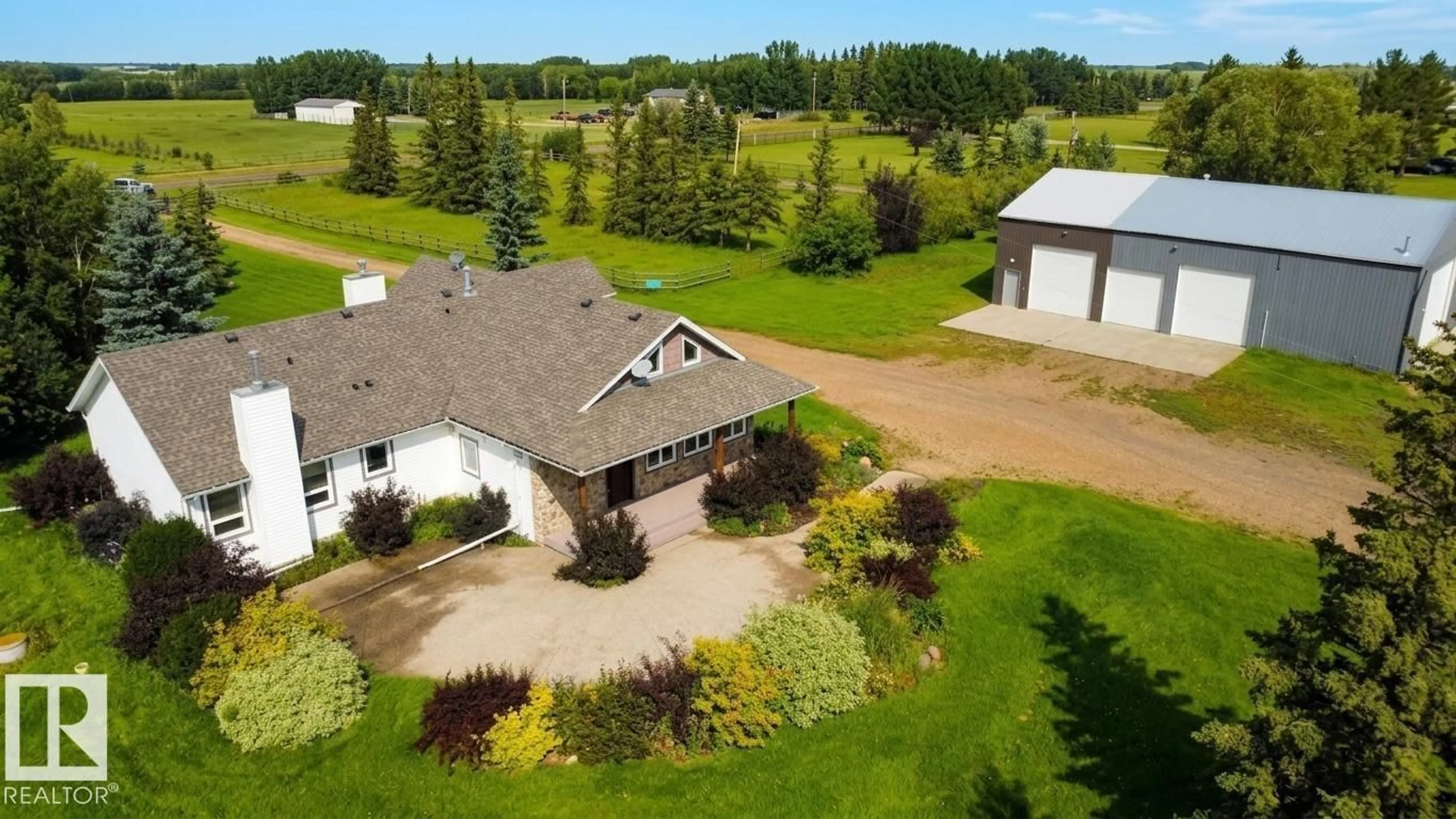 A pic from outside/outdoor area/front of a property/back of a property/a pic from drone, unknown for 26317 TWP ROAD 552, Rural Sturgeon County Alberta T8R1T4