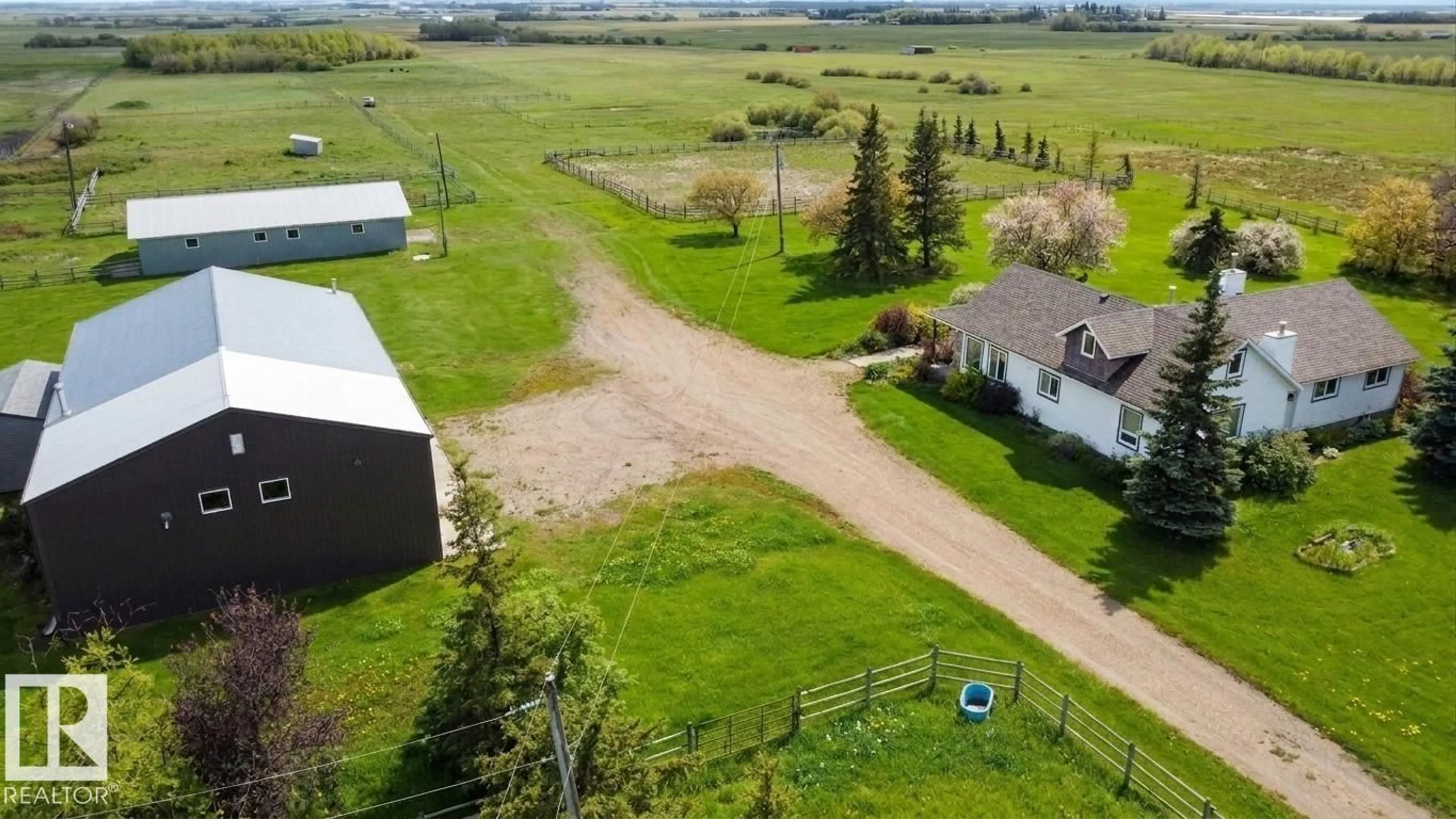 A pic from outside/outdoor area/front of a property/back of a property/a pic from drone, unknown for 26317 TWP ROAD 552, Rural Sturgeon County Alberta T8R1T4