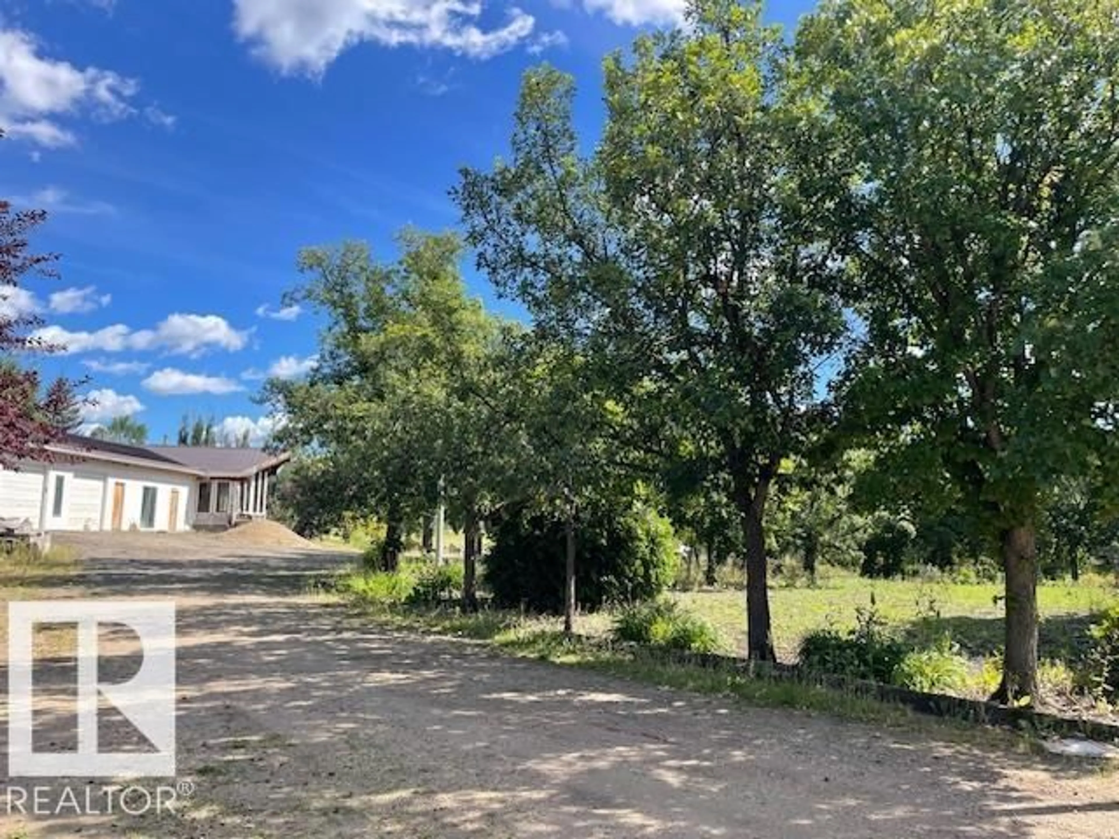 A pic from outside/outdoor area/front of a property/back of a property/a pic from drone, forest/trees view for 60 50416 RGE RD 245, Rural Leduc County Alberta T4X0P5
