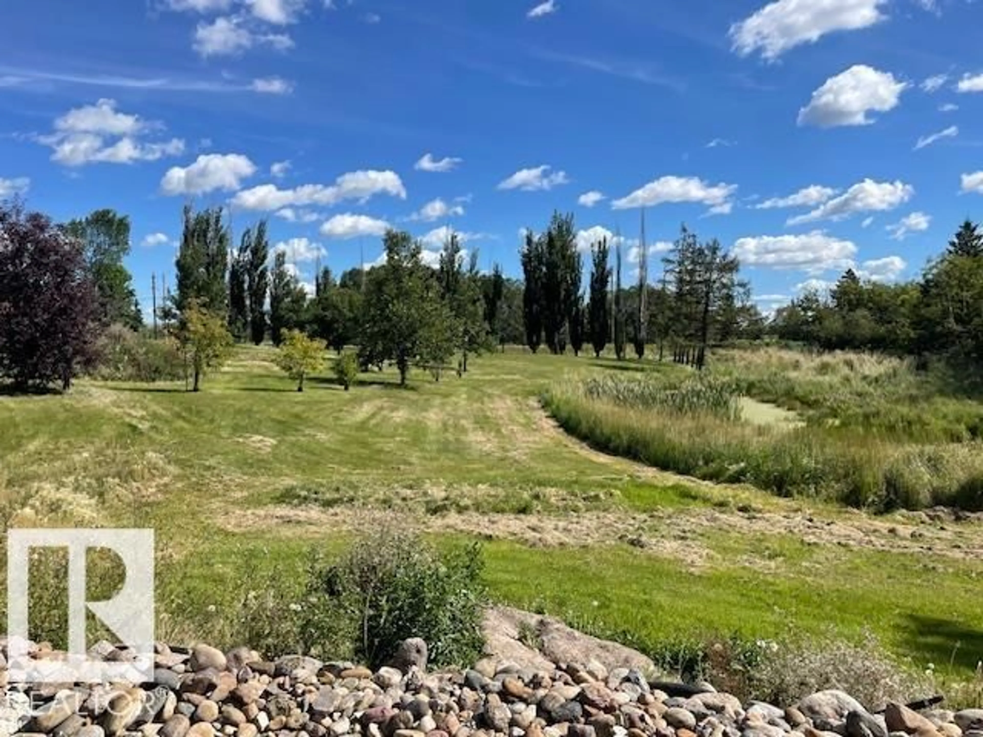 A pic from outside/outdoor area/front of a property/back of a property/a pic from drone, forest/trees view for 60 50416 RGE RD 245, Rural Leduc County Alberta T4X0P5