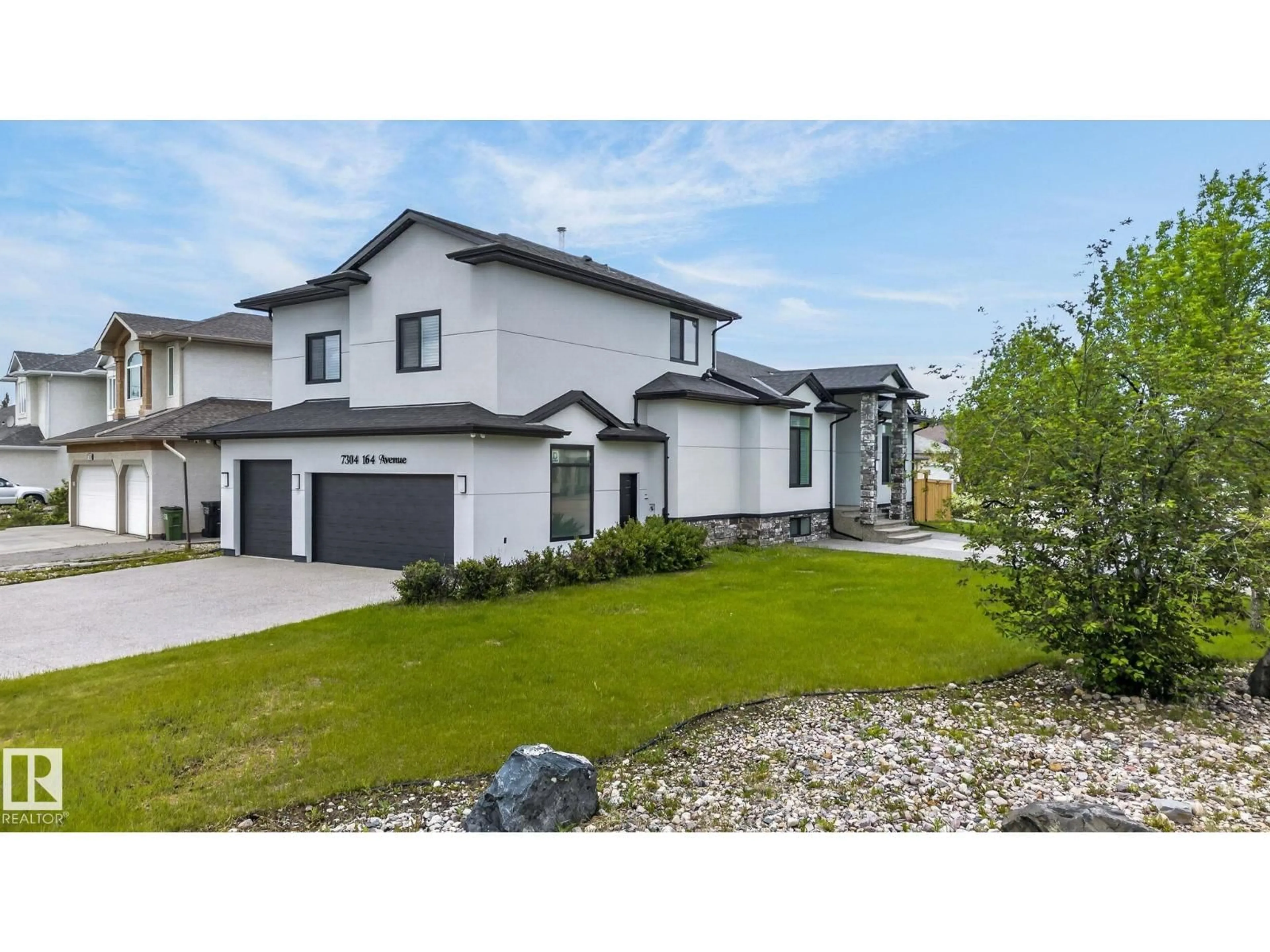 Home with vinyl exterior material, street for 7304 164 AV, Edmonton Alberta T5Z3Y3