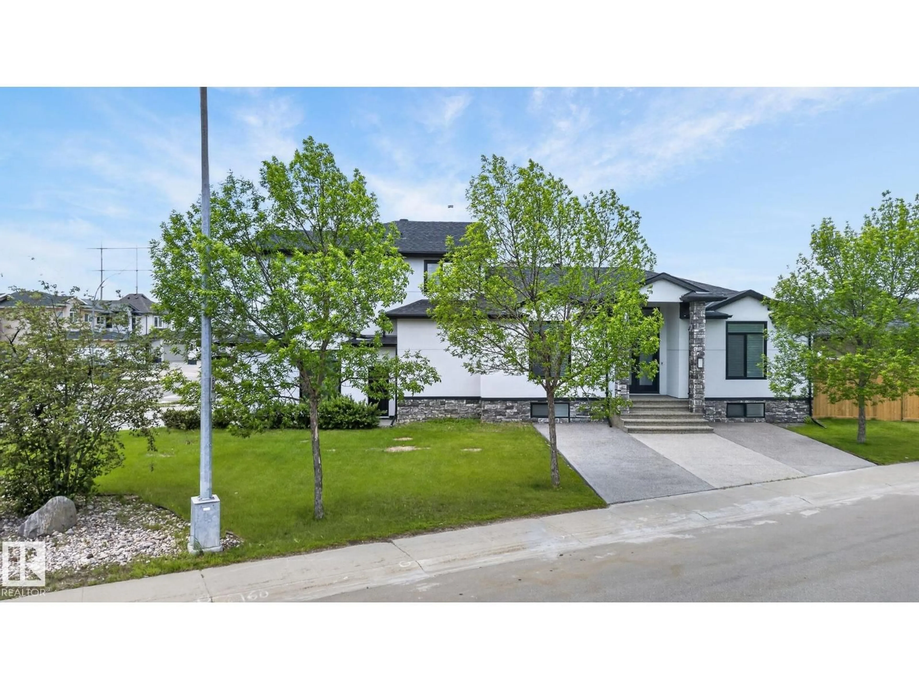 Home with vinyl exterior material, street for 7304 164 AV, Edmonton Alberta T5Z3Y3