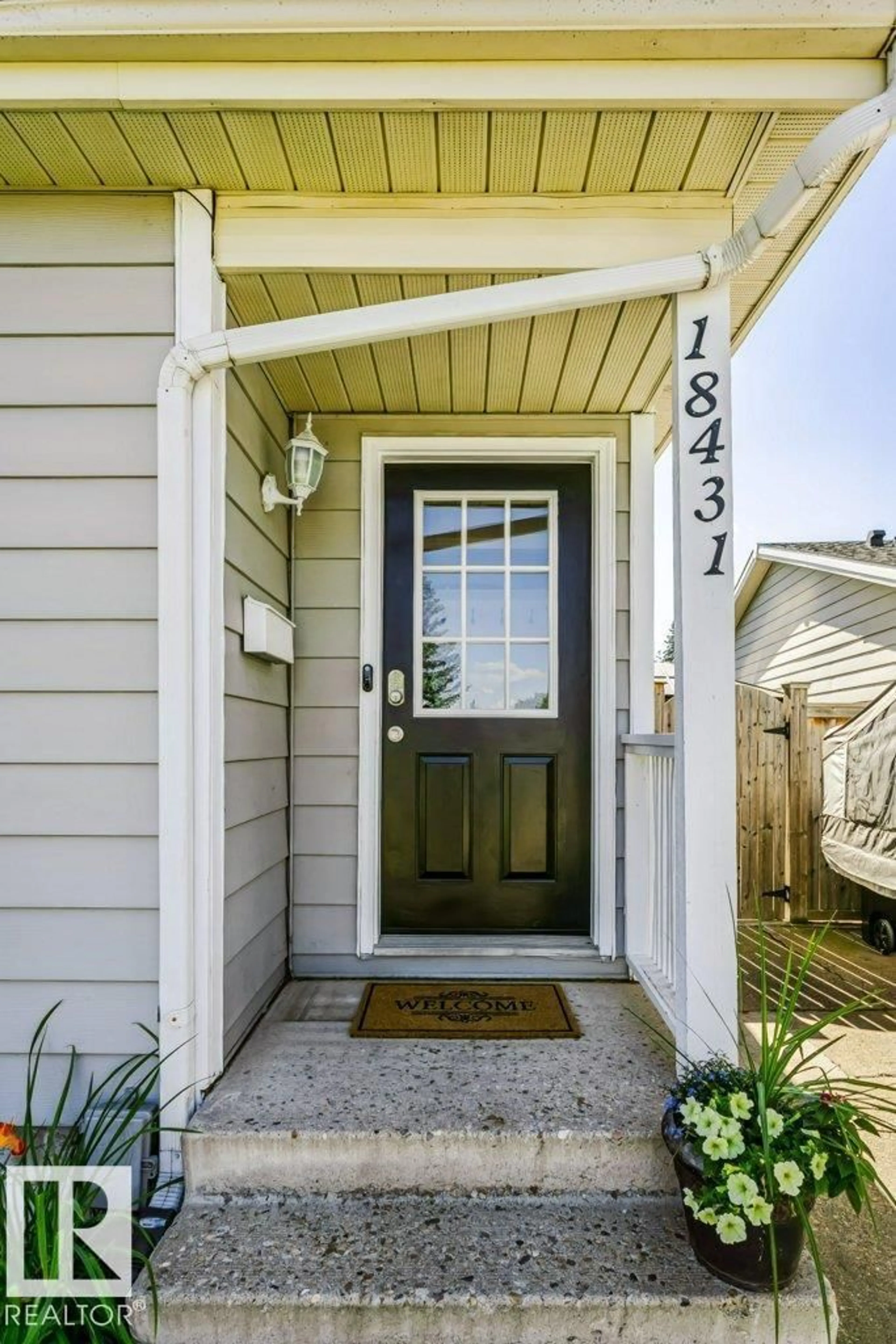 Home with vinyl exterior material, street for 18431 95A AV, Edmonton Alberta T5T3V7