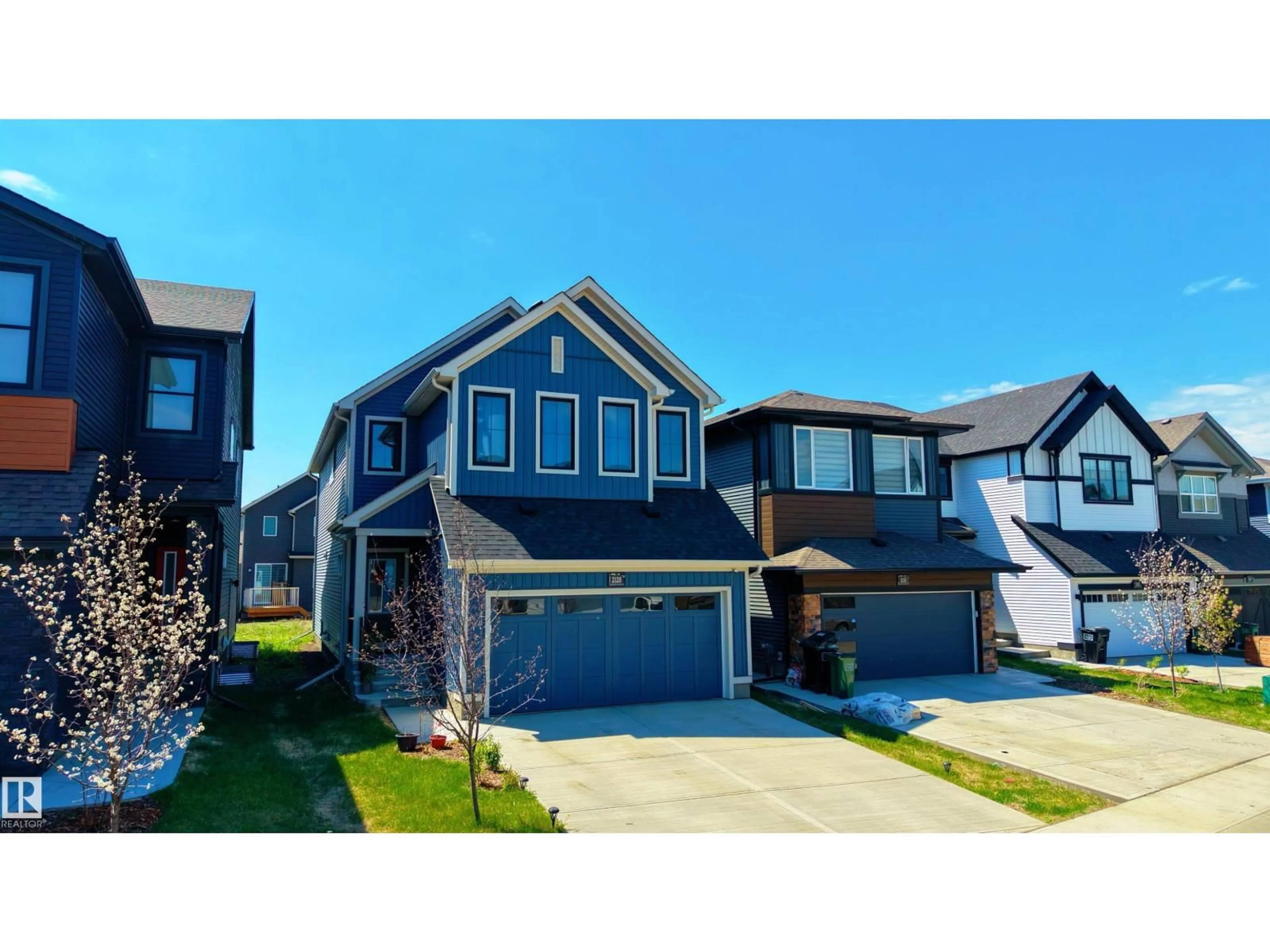 Home with vinyl exterior material, street for 2120 MUCKLEPLUM CR, Edmonton Alberta T6X3H1