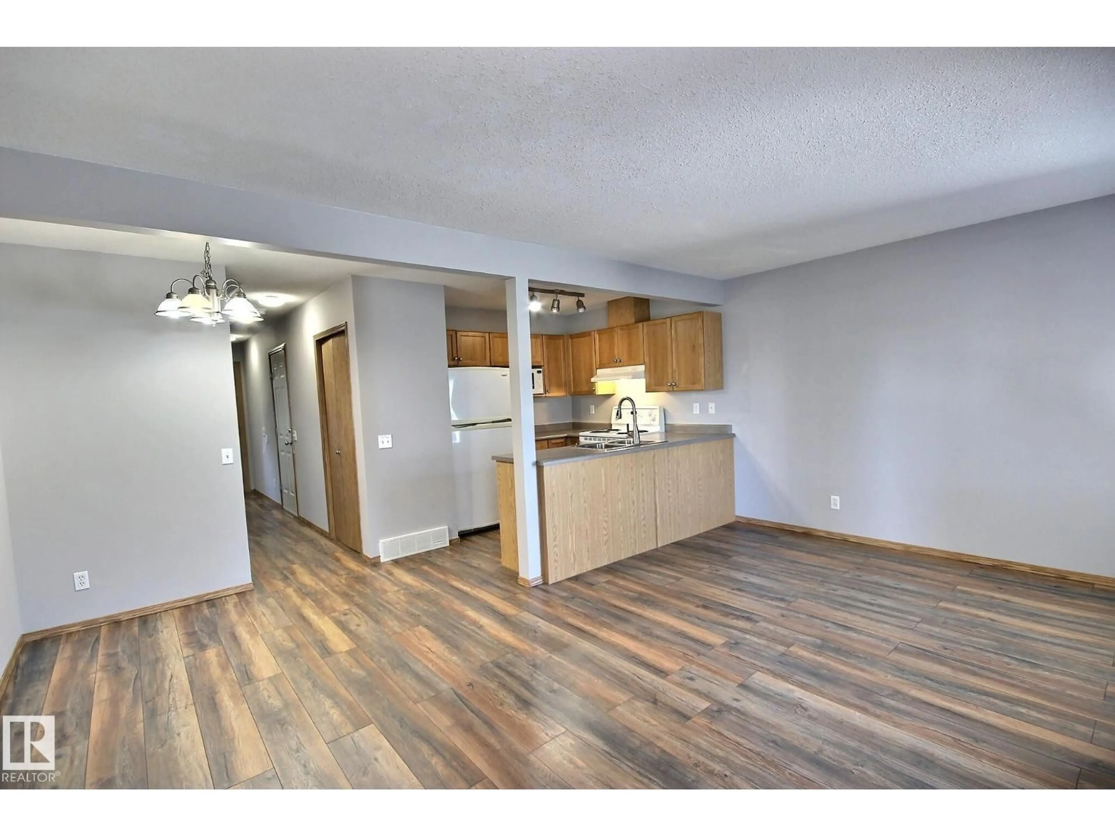 Open concept kitchen, wood/laminate floor for 53 16823 84 ST NW, Edmonton Alberta T5Z3S4