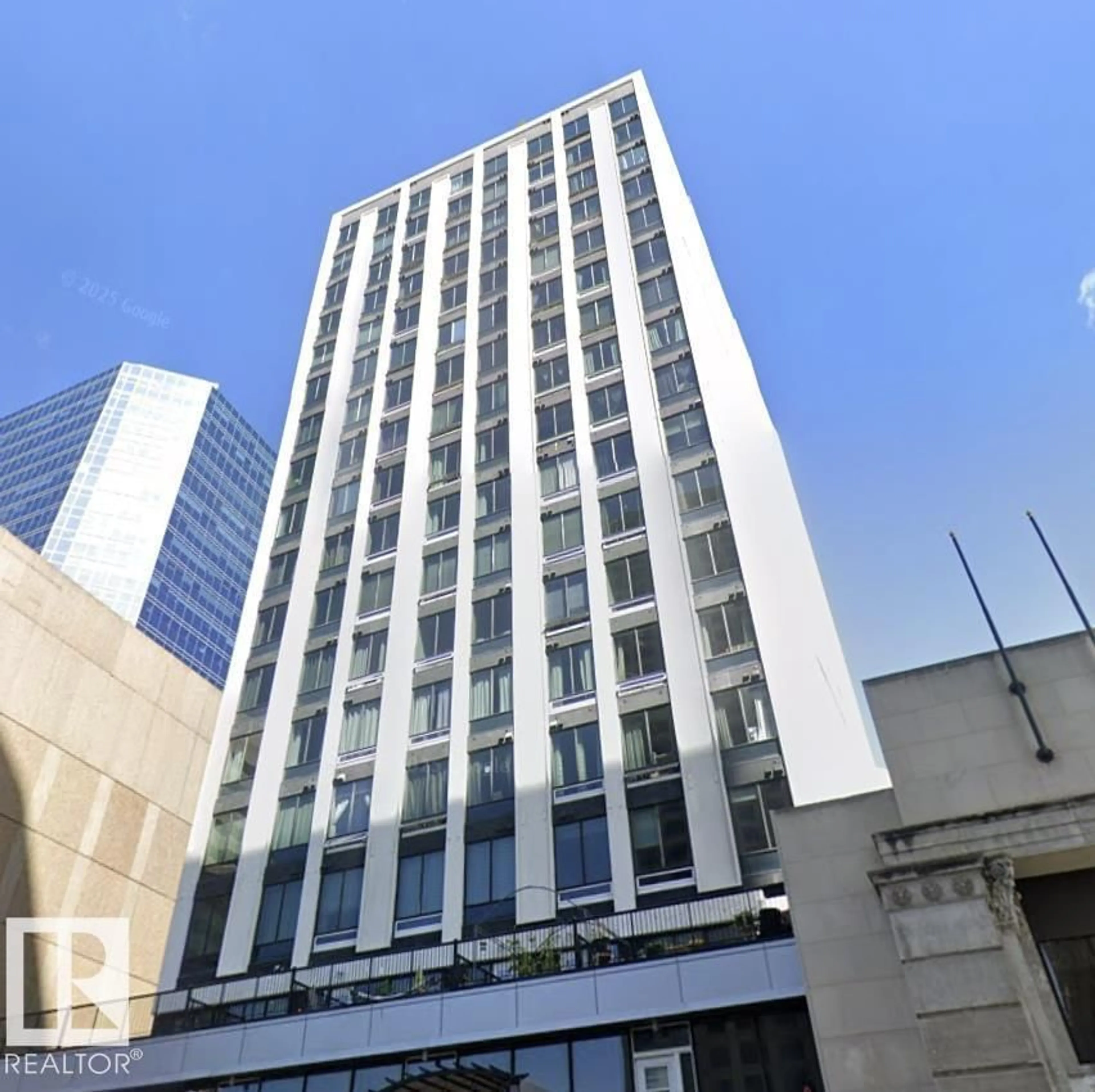 Indoor foyer for 1701 JASPER AV NW, Edmonton Alberta T5J1R9