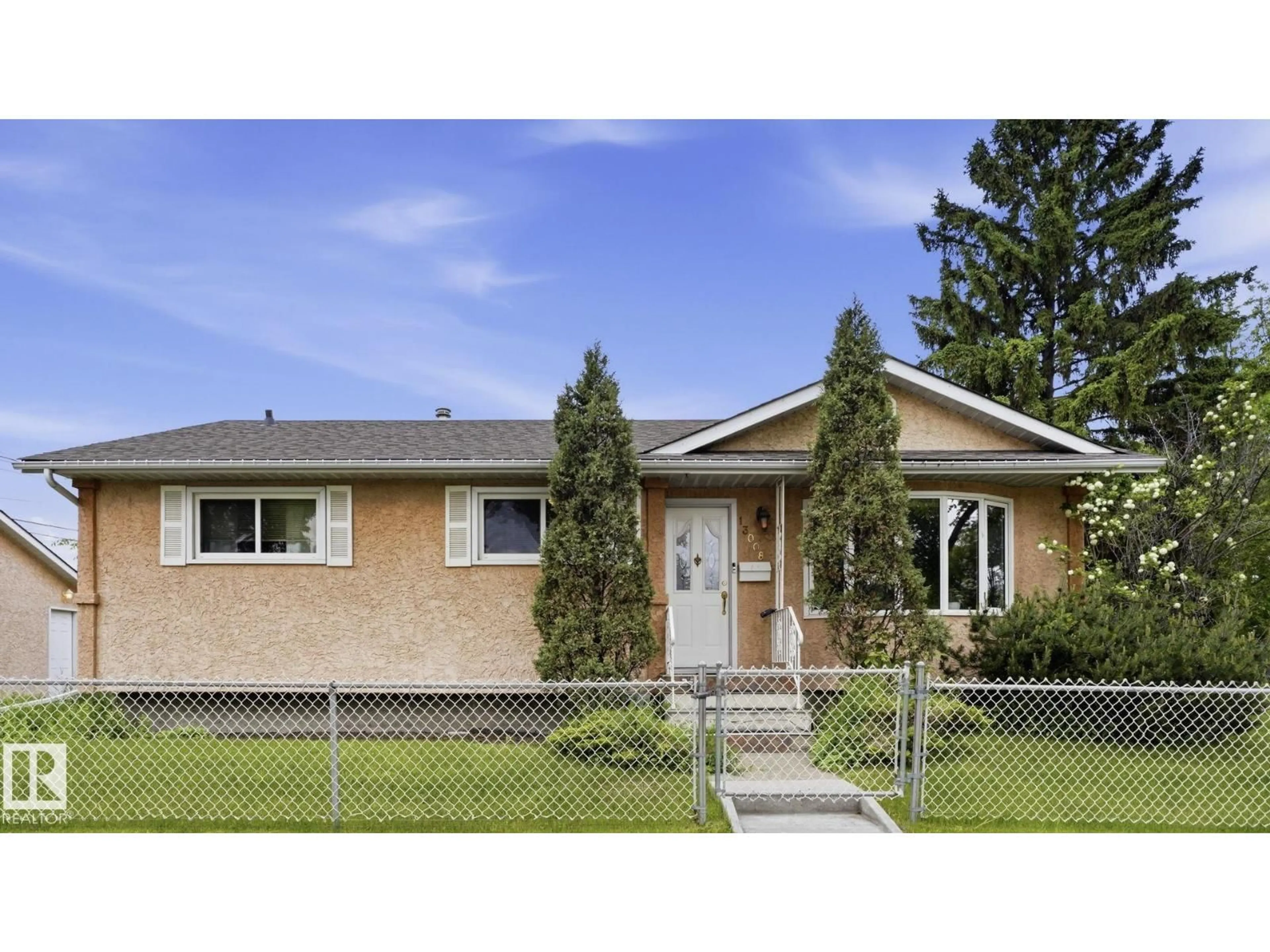Home with vinyl exterior material, street for 13008 105 ST NW, Edmonton Alberta T5E4R9