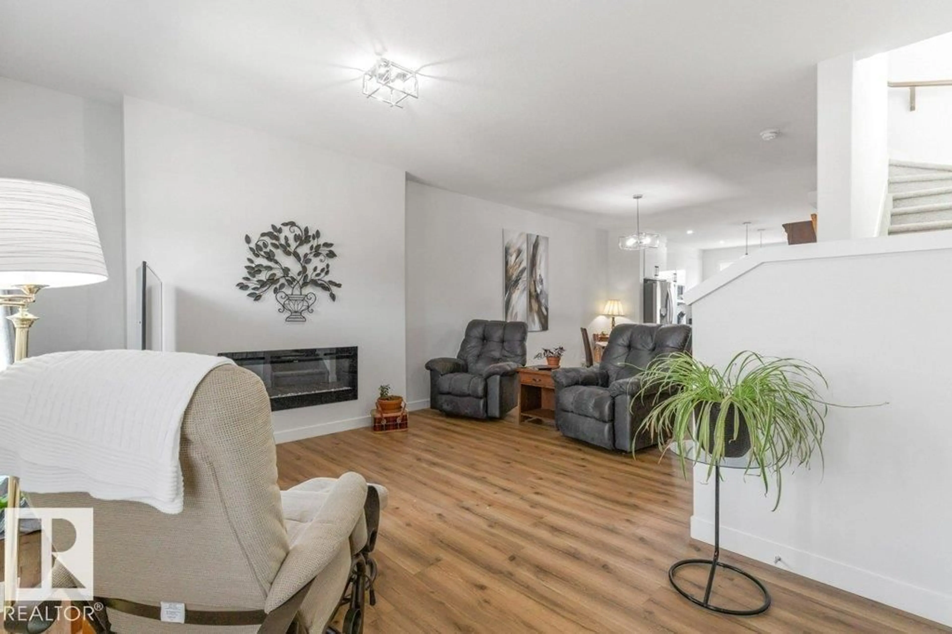 Living room with furniture, wood/laminate floor for 114 CASTILIAN BV, Sherwood Park Alberta T8H3A6