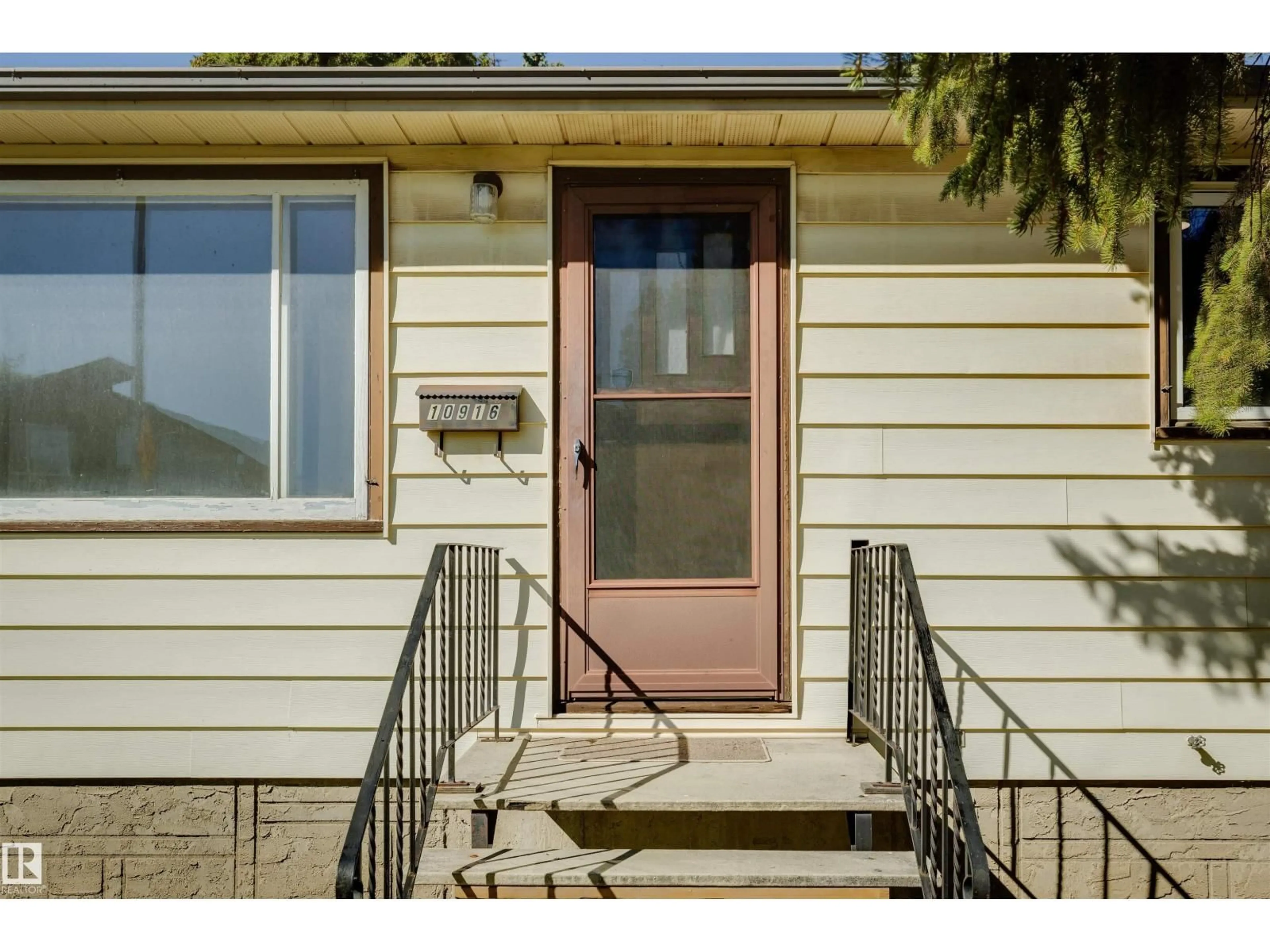 Home with vinyl exterior material, street for NW - 10916 151 ST, Edmonton Alberta T5P1W1