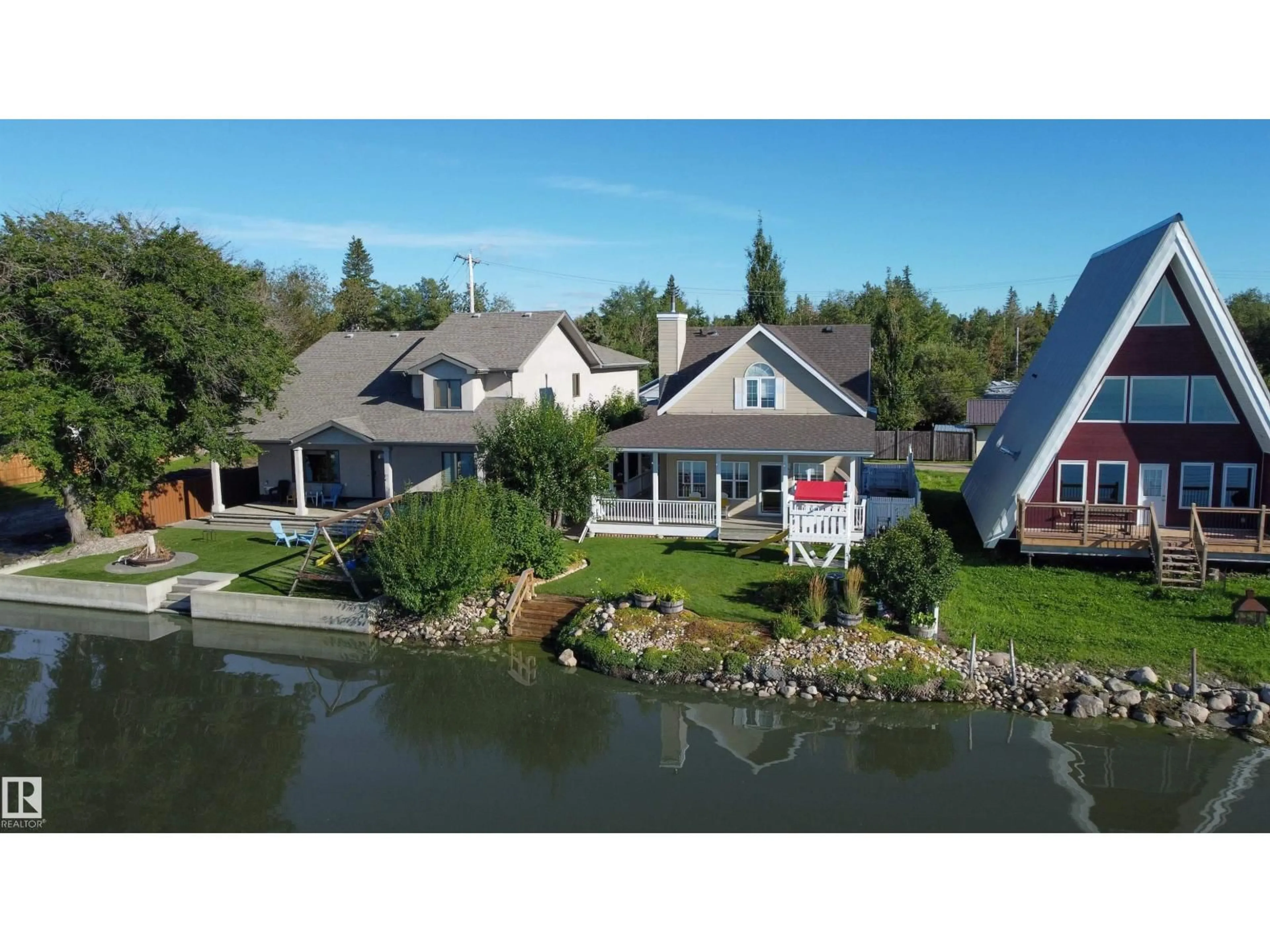 A pic from outside/outdoor area/front of a property/back of a property/a pic from drone, water/lake/river/ocean view for 5309 51 AV, Rural Lac Ste. Anne County Alberta T0E0A0