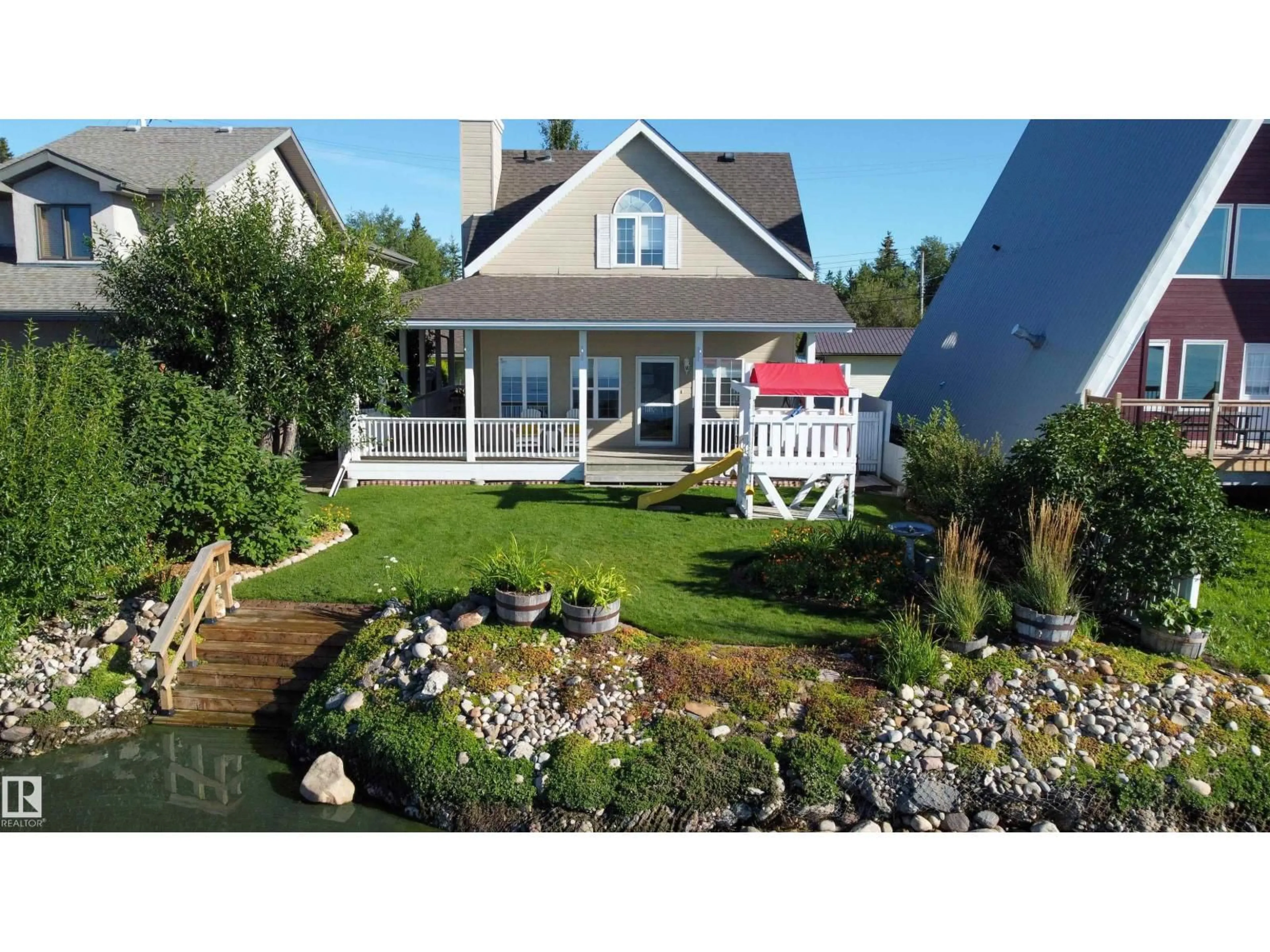 A pic from outside/outdoor area/front of a property/back of a property/a pic from drone, water/lake/river/ocean view for 5309 51 AV, Rural Lac Ste. Anne County Alberta T0E0A0
